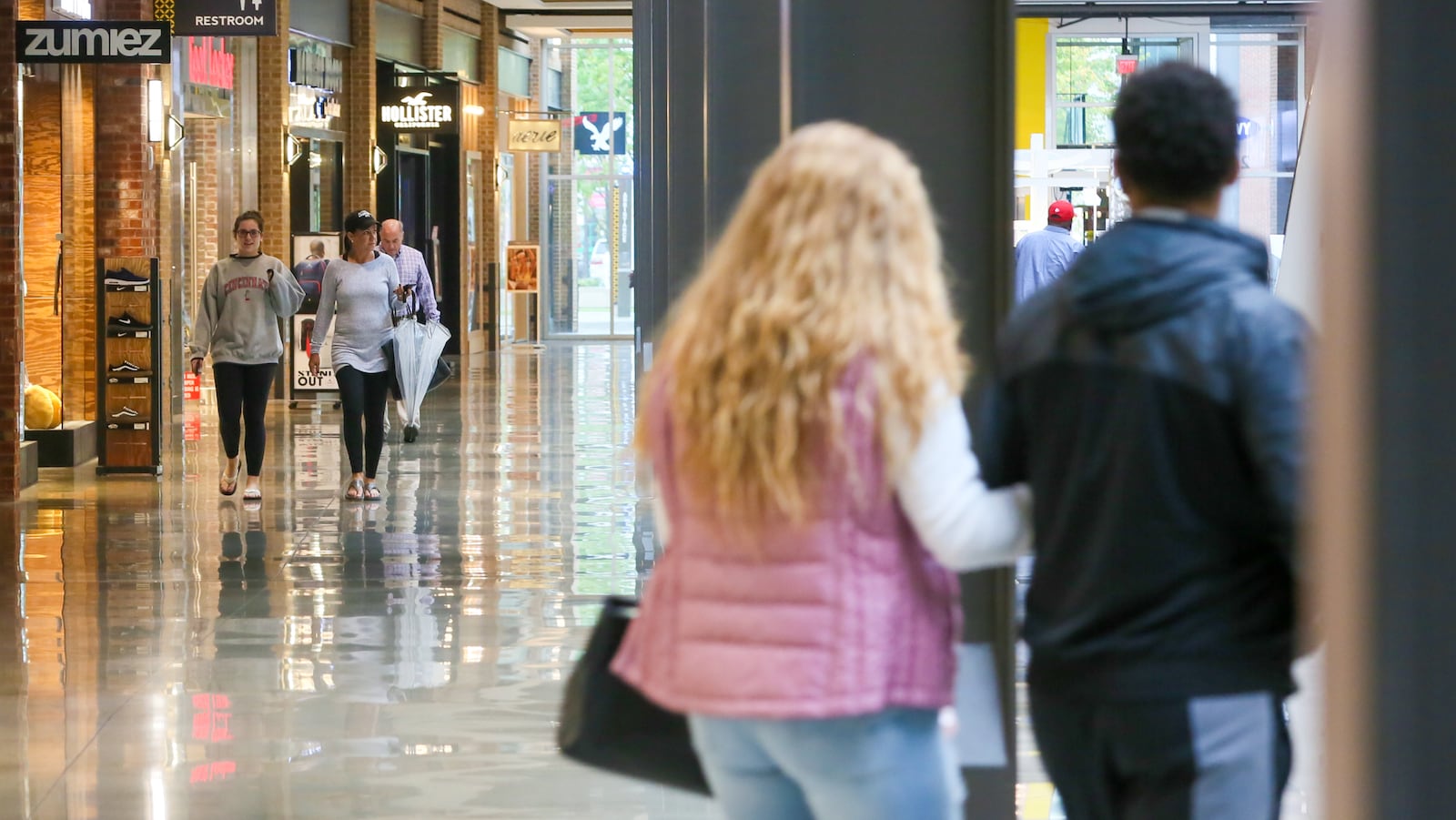 Shoppers walk through the Foundry at Liberty Center. GREG LYNCH / STAFF