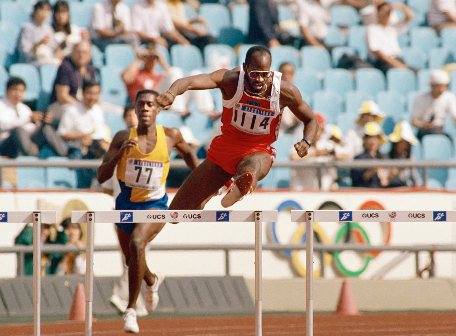 FILE - In this Sept. 23, 1988, file photo, Edwin Moses of the United States, right, pulls ahead of Allan Ince of Barbados during heat competition in the men's 400 meter hurdles at the Olympics in Seoul, Korea. (AP Photo/Lennox McLendon, File)