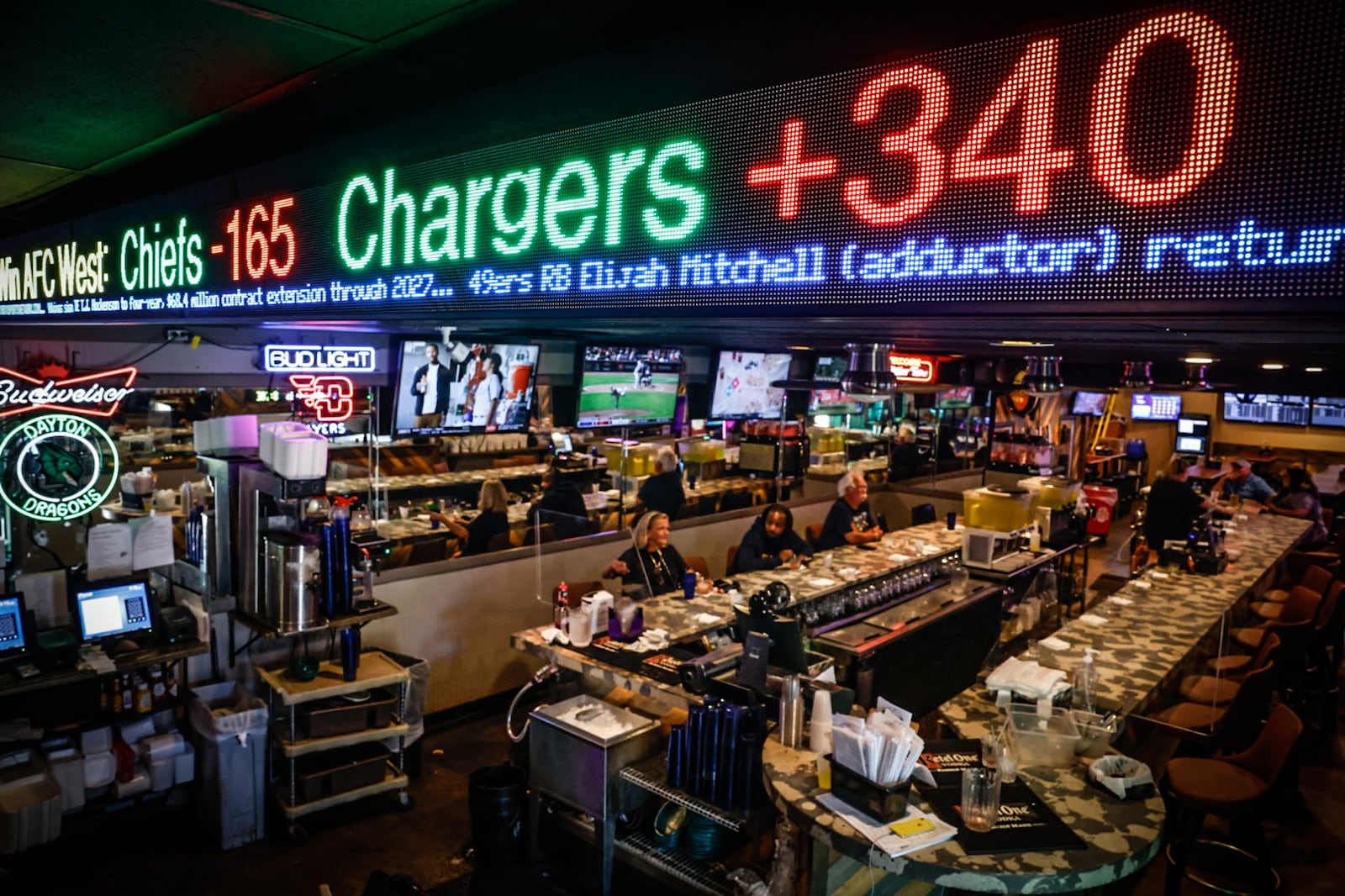 The Elsa's restaurant in Kettering has a new sports ticker above the bar, with live betting odds and news updates for customers who want to make bets on games. JIM NOELKER/STAFF