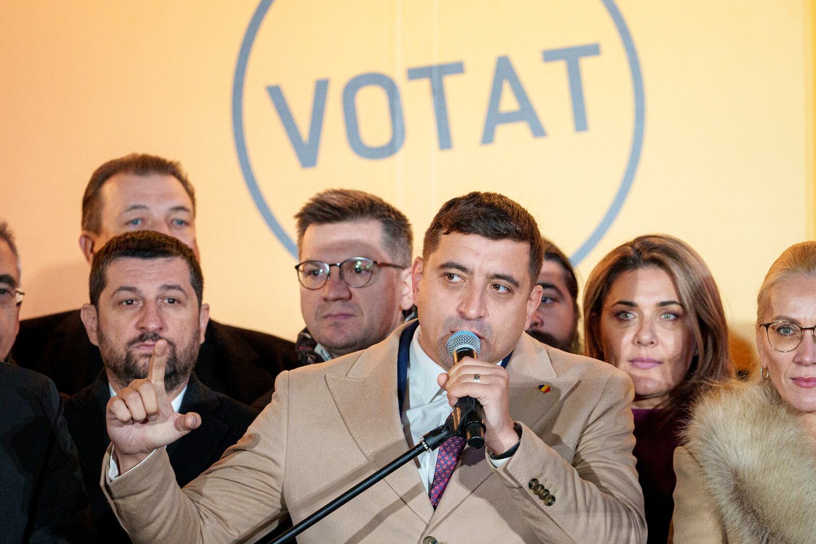 George Simion, the Alliance for the Unity of Romanians (AUR) candidate for president gestures as he speaks to media after polls closed during the country's presidential elections, in Bucharest, Romania, Sunday, Nov. 24, 2024. (AP Photo/Andreea Alexandru)