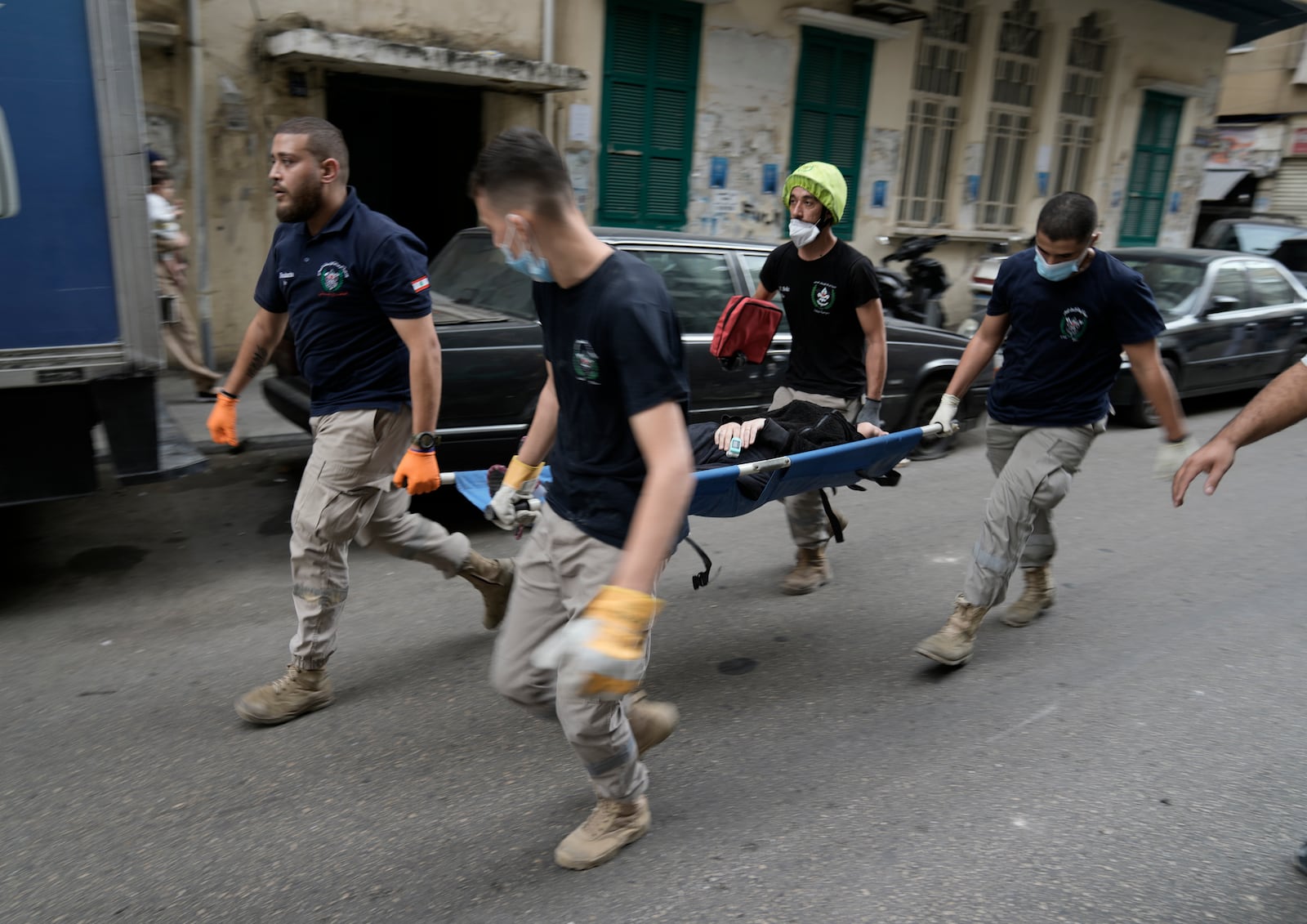 Rescuers evacuate a wounded woman from the site of an Israeli airstrike that hit a building in central Beirut's Ras el-Nabaa neighborhood, Lebanon, Sunday, Nov. 17, 2024. (AP Photo/Bilal Hussein)