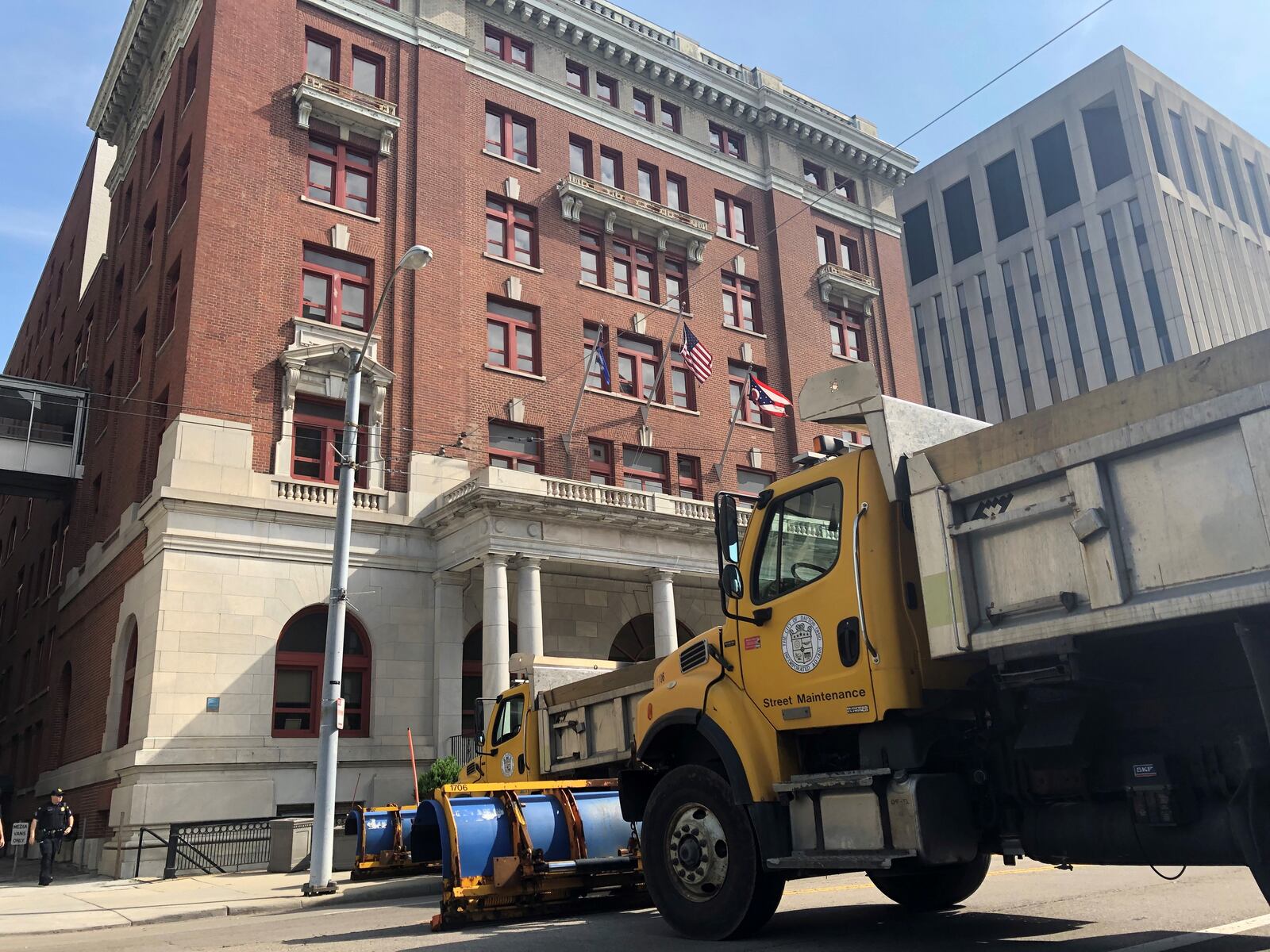 Street maintenance trucks parked outside of Dayton City Hall in 2019. CORNELIUS FROLIK / STAFF