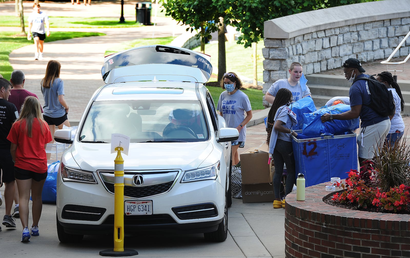 Upper classmen help freshman during move-in day at the University of Dayton, Wednesday Aug. 18, 2021. MARSHALL GORBY\STAFF