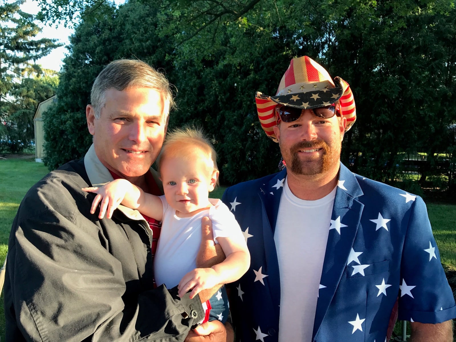 Three generations of Champaign County farmers — Dale Circle, his grandson Thor and son Case — came to support Clayton Murphy  on Wednesday morning at an Olympics Watch Party at the Piqua home of Clayton’s dad, Mark, and stepmom, Christal. Photo by Tom Archdeacon