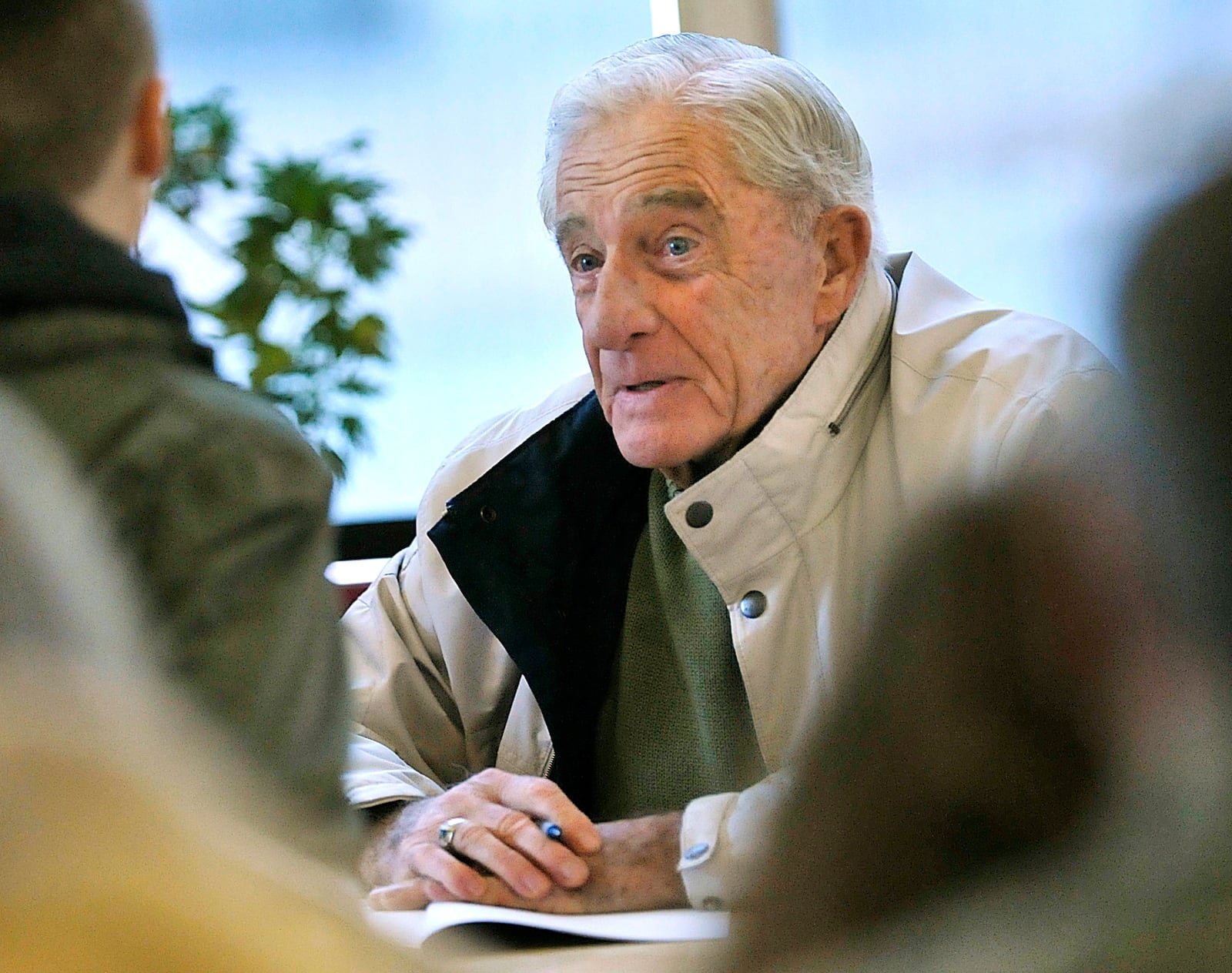 FILE - Donn Fendler chats with a young reader at a book signing in Bangor, Maine, Nov. 19, 2011. (AP Photo/Michael C. York, File)