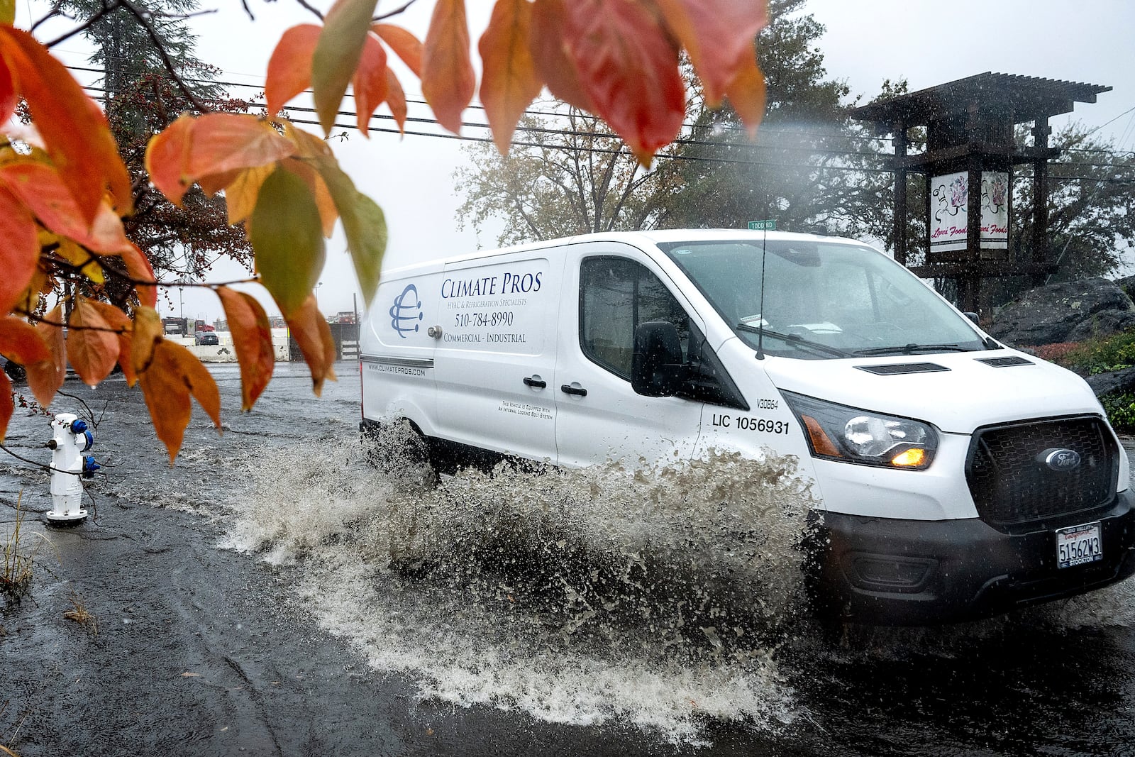 A truck crosses a flooded road Wednesday, Nov. 20, 2024, in Santa Rosa, Calif. (AP Photo/Noah Berger)