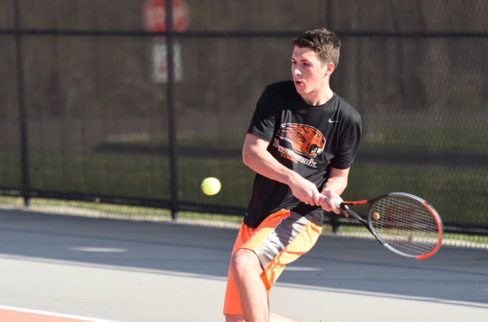 Beavercreek High School senior Aaron Staiger works on his backhand during varsity team practice earlier this fall. Tennis is among his many after-school activities. CONTRIBUTED PHOTO