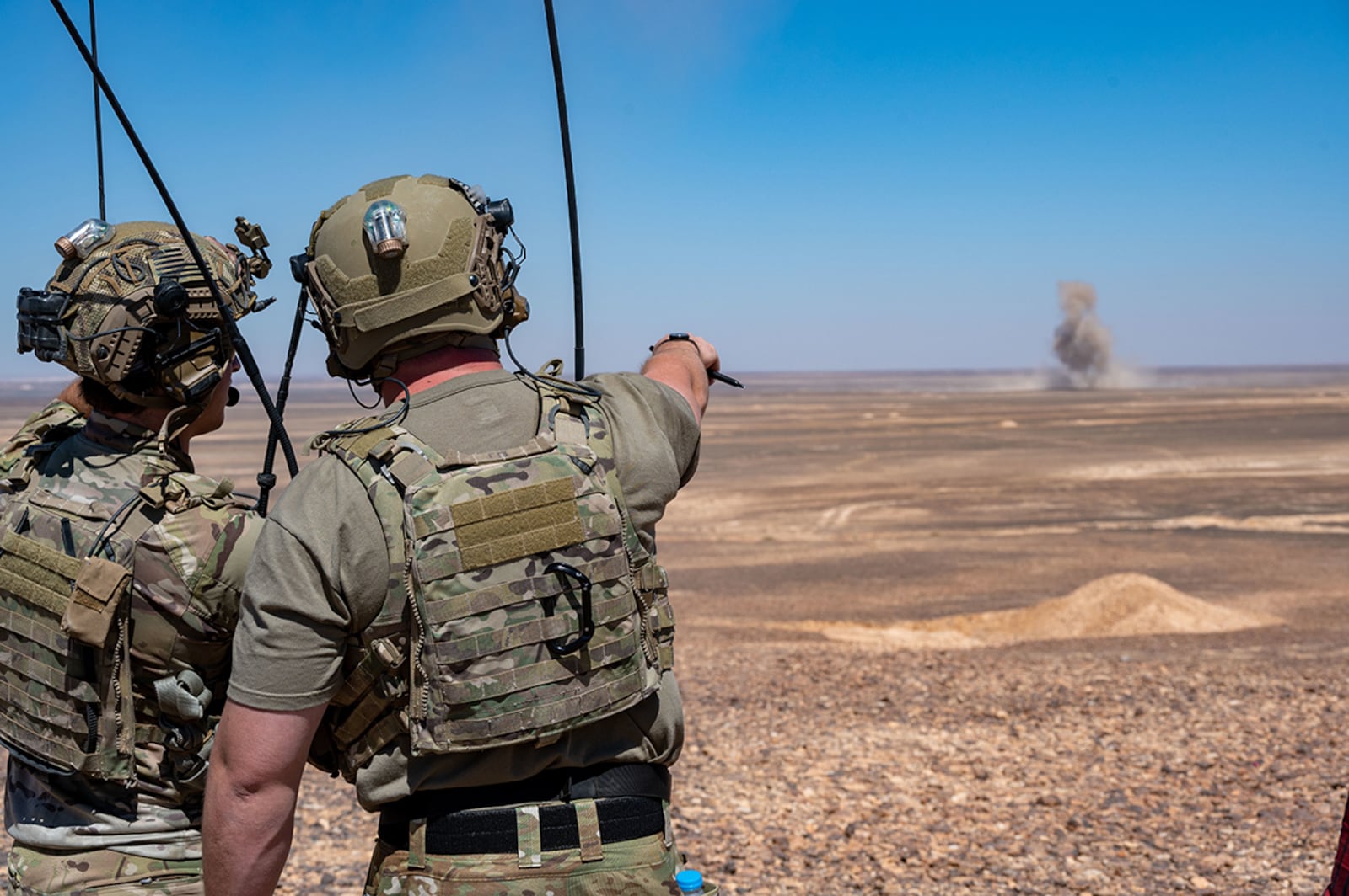 Two Joint Terminal Attack Controllers observe a bomb impact during a routine training exercise with 332nd Air Expeditionary Wing F-15E Strike Eagles at an undisclosed location in southwest Asia on July 7. The F-15E is a dual-role fighter designed to perform air-to-air and air-to-ground missions with an array of avionics and electronics systems that give it the capability to fight at low altitude, day, night and in all weather conditions. U.S. AIR FORCE PHOTO/MASTER SGT. KELLY GOONAN