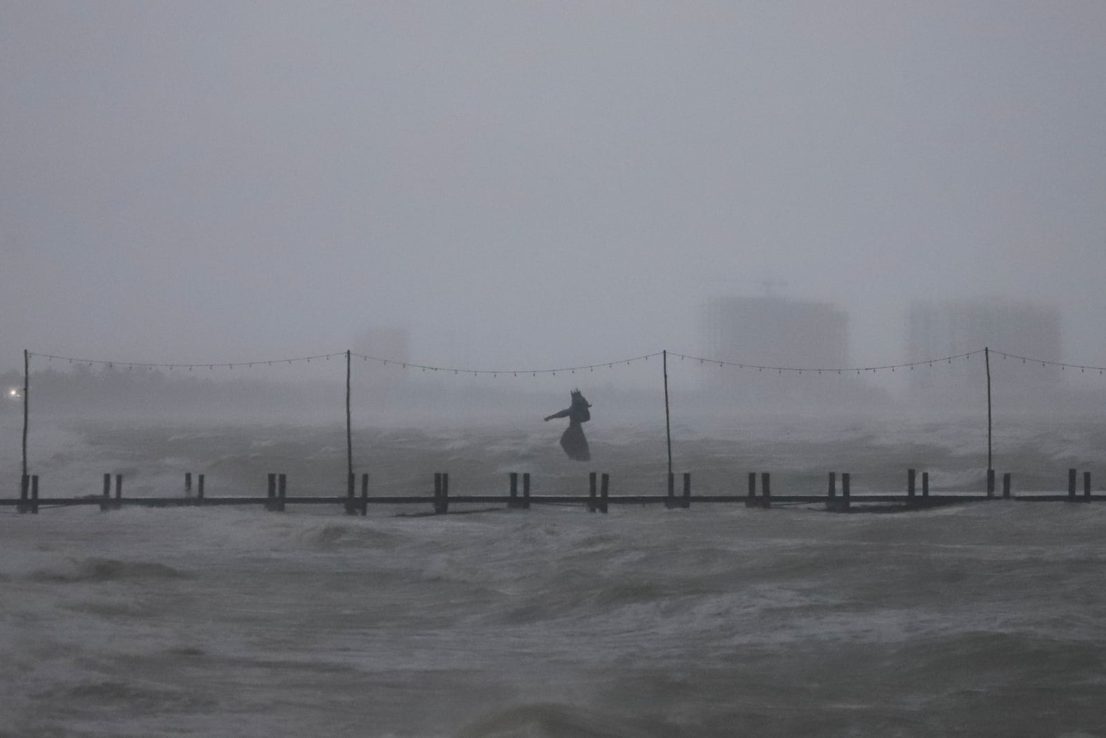 A sculpture of Poseidon stands in the ocean after the eye of Hurricane Milton passed off the coast of Progreso, Yucatan state, Mexico, Tuesday, Oct. 8, 2024. (AP Photo/Martin Zetina)