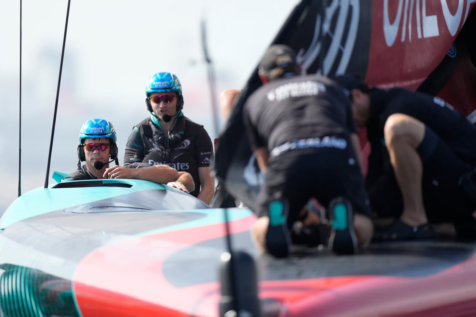 Emirates Team New Zealand crew prepares for the Louis Vuitton 37th America's Cup Day 2 race in Barcelona, Spain, Sunday, Oct. 13, 2024. (AP Photo/Bernat Armangue)