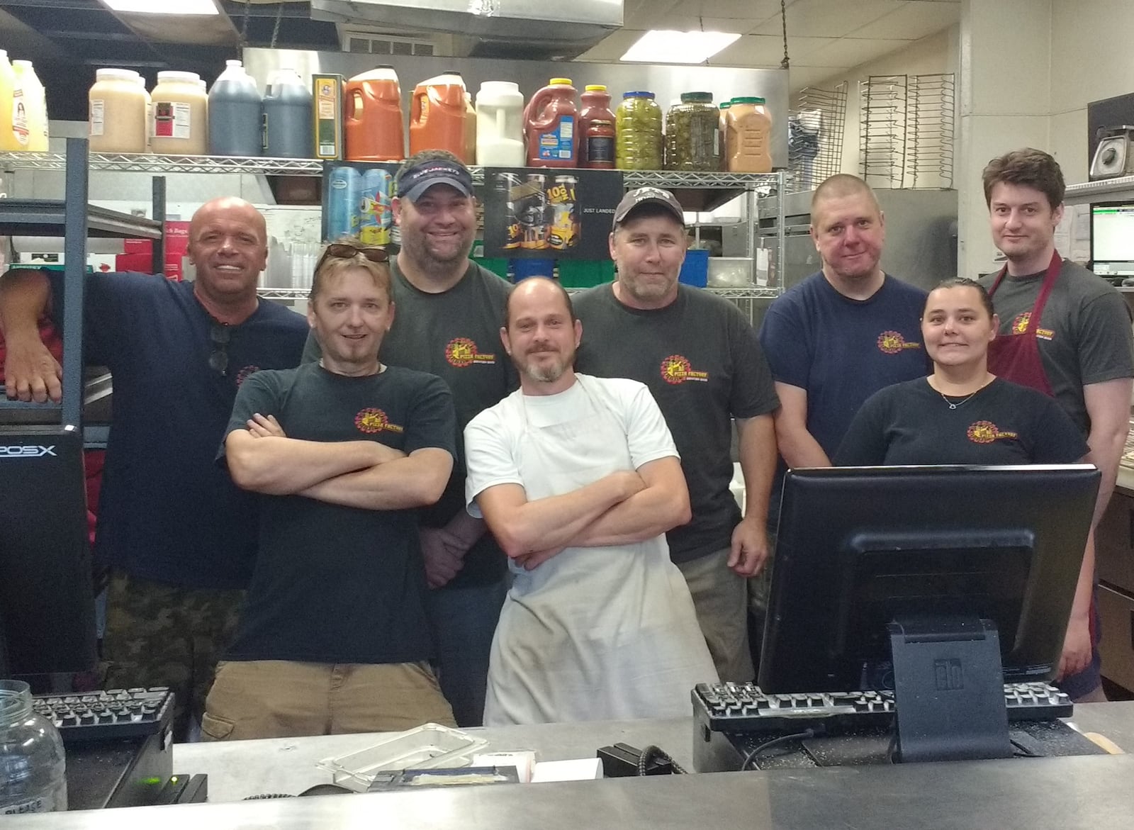 Staff members of Dayton's Original Pizza Factory, including, from left to right: Brian Pilgrim, Rick Pierce, John Sullivan, Justin Barkley, Bill Daniels, Dan Azbill, Angie Elzey, and Daniel Hughes. CONTRIBUTED