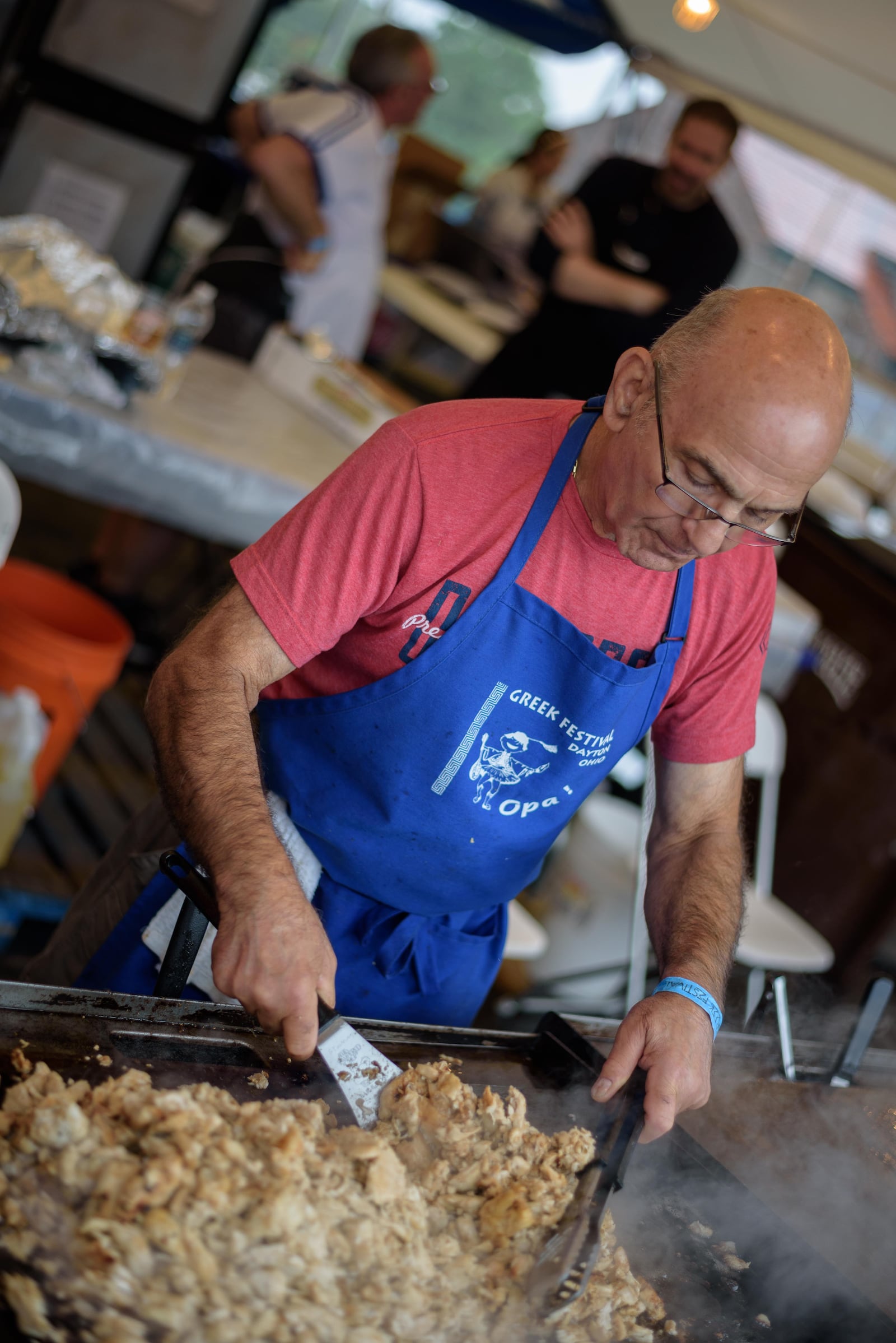 The 60th annual Greek Festival in 2018 at The Annunciation Greek Orthodox Church, 500 Belmonte Park North in Dayton, was impacted by inclement weather, prompting organizers to offer handmade food made by volunteers to go. This year, that concept will return as a result of the coronavirus pandemic. The Greek Festival is among a handful of cultural celebrations planning to offer festival food to go. TOM GILLIAM / DAYTON DAILY NEWS ARCHIVES