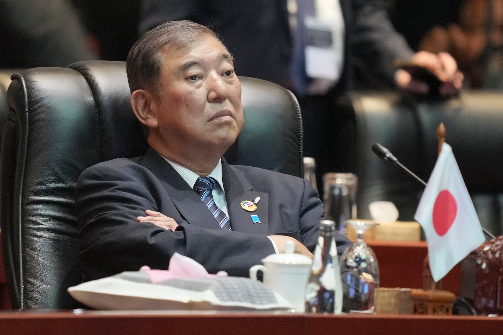 Japanese Prime Minister Shigeru Ishiba waits before the start of the 19th East Asia Summit in Vientiane, Laos, Friday, Oct. 11, 2024. (AP Photo/Dita Alangkara)