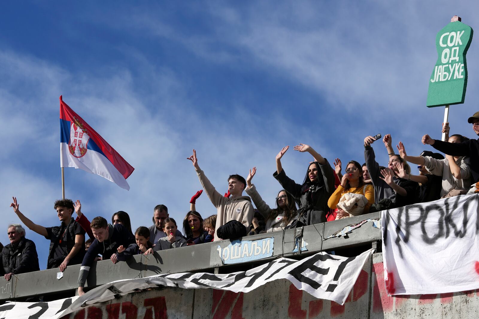 Students during a student-led 24 hour block on an intersection to protest the deaths of 15 people killed in the November collapse of a train station canopy, in Belgrade, Serbia, Monday, Jan. 27, 2025. (AP Photo/Darko Vojinovic)