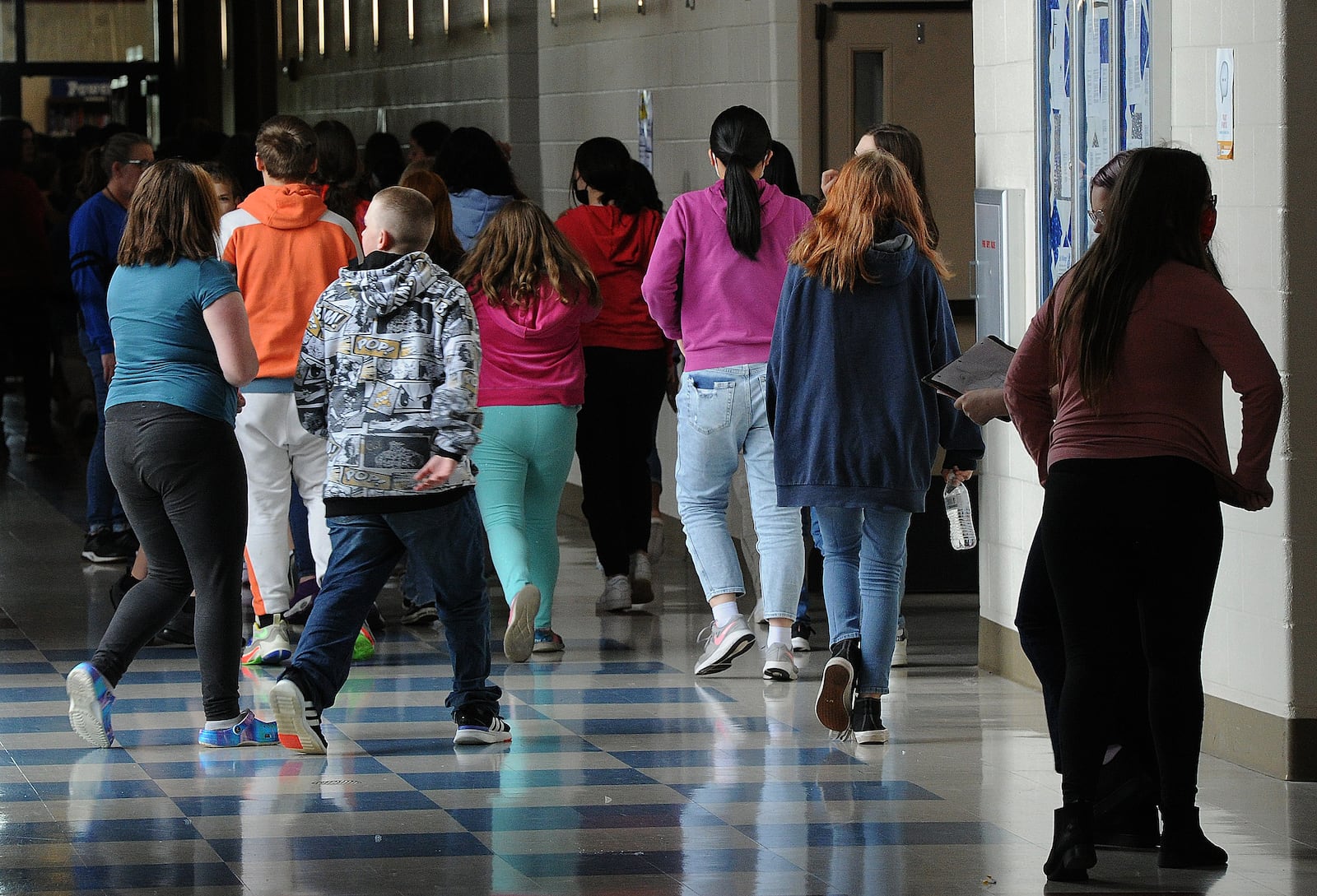 Students at Miamisburg Middle School walk through the hallways on May 5. Miamisburg is one of the schools in the region who have added mental health staff and are working to support students and teachers after a difficult two years. School and hospital officials are concerned about teen's mental health across the Miami Valley. Marshall Gorby \ Staff 