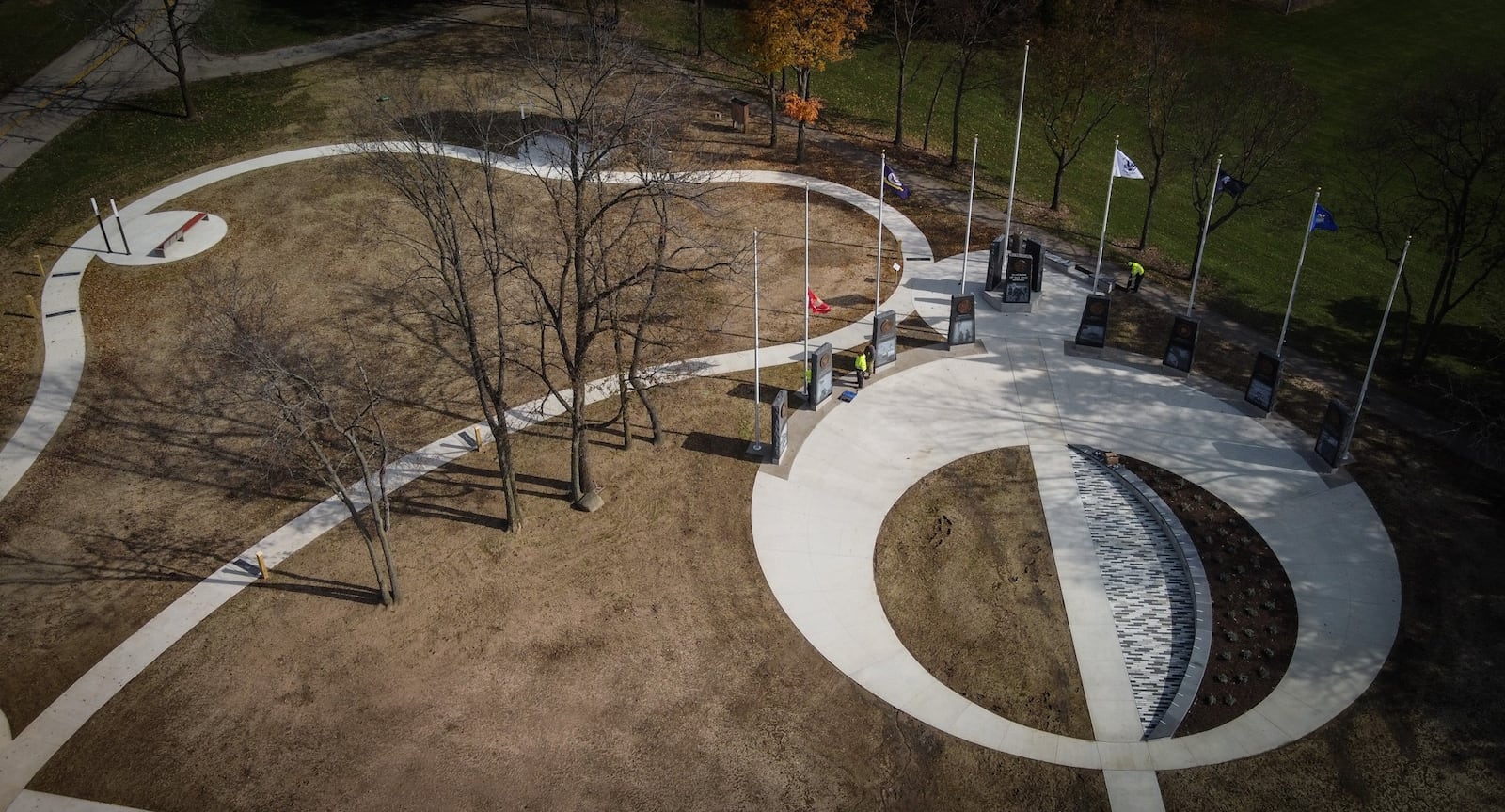 Workers add finishing touches on the new veteran's Memorial being unveiled on Saturday Nov. 6, 2021 at Thomas Cloud Park. JIM NOELKER/STAFF