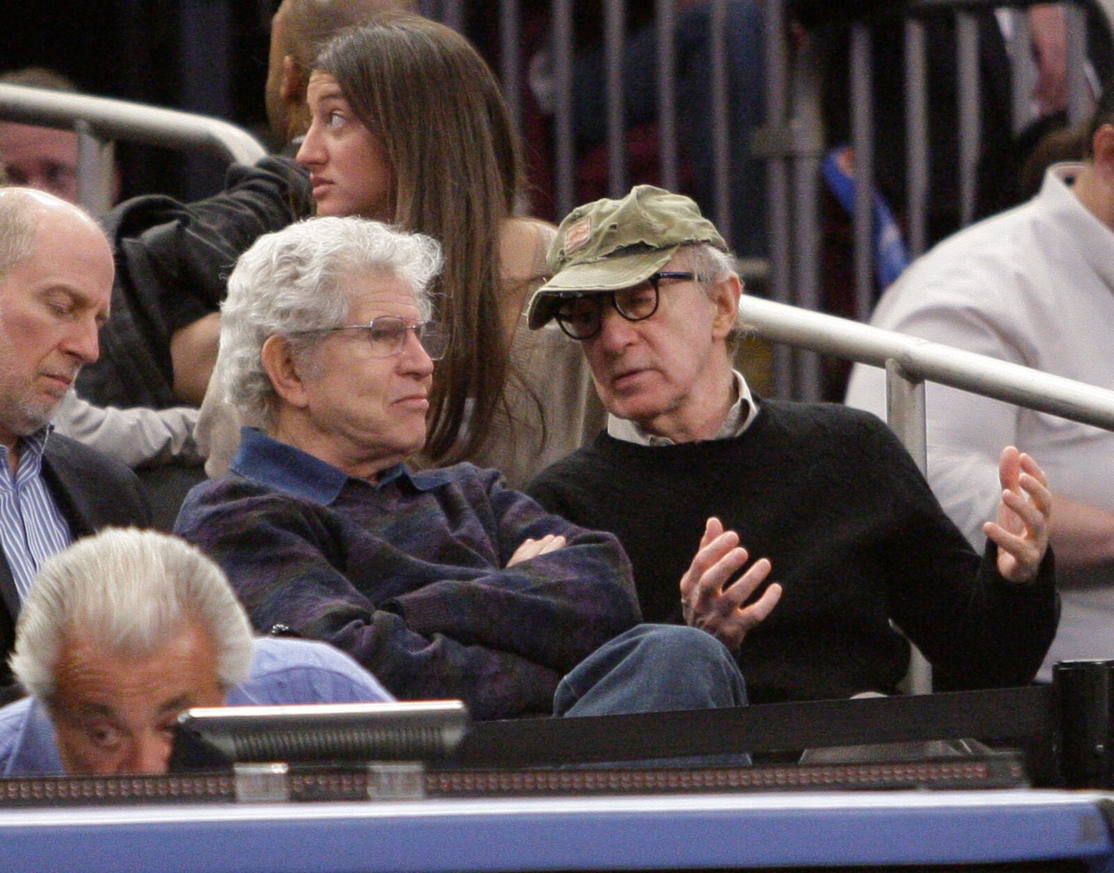 FILE - Director Woody Allen, right, speaks to actor Tony Roberts during a break in the action during the second half of an NBA basketball game between the New York Knicks and the New Orleans Hornets, March 2, 2011, at Madison Square Garden in New York. (AP Photo/Mary Altaffer, File)