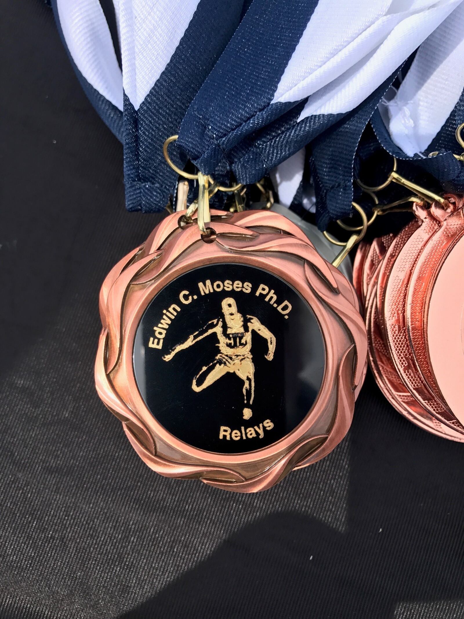 One of the medals being awarded Saturday at the Edwin C. Moses Relays at Welcome Stadium. Tom Archdeacon/CONTRIBUTED