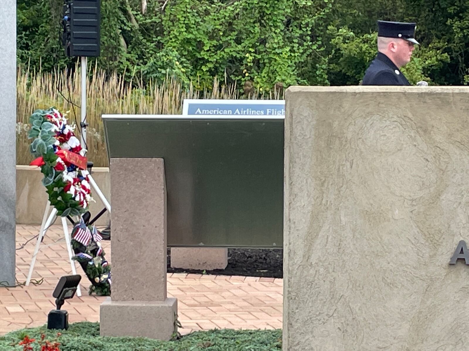 Wreaths were part of a 9/11 memorial event Sunday in Beavercreek, where speakers stressed the need for future generations to remember the 2001 terrorist attack. NICK BLIZZARD/STAFF