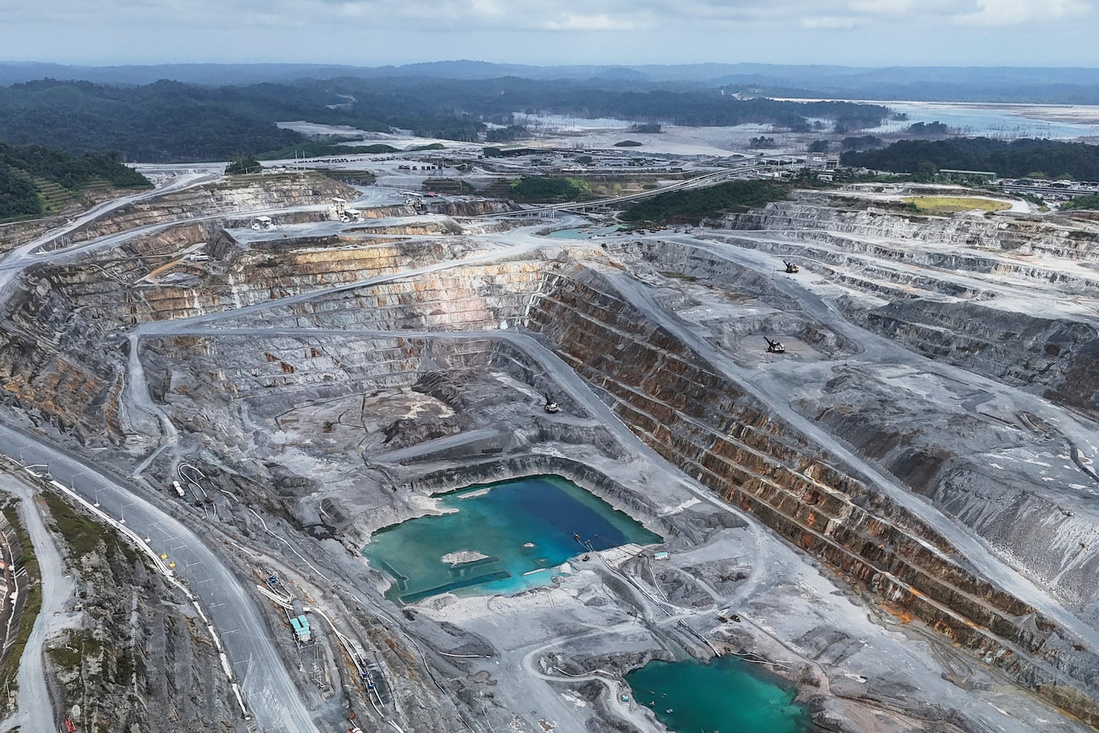 Tailing ponds are seen during a media tour of the Cobre Panamá copper mine, owned by Canada's First Quantum Minerals, which was closed after Panama's Supreme Court ruled that the government concession was unconstitutional in Donoso, Panama, Friday, March 21, 2025. (AP Photo/Matias Delacroix)