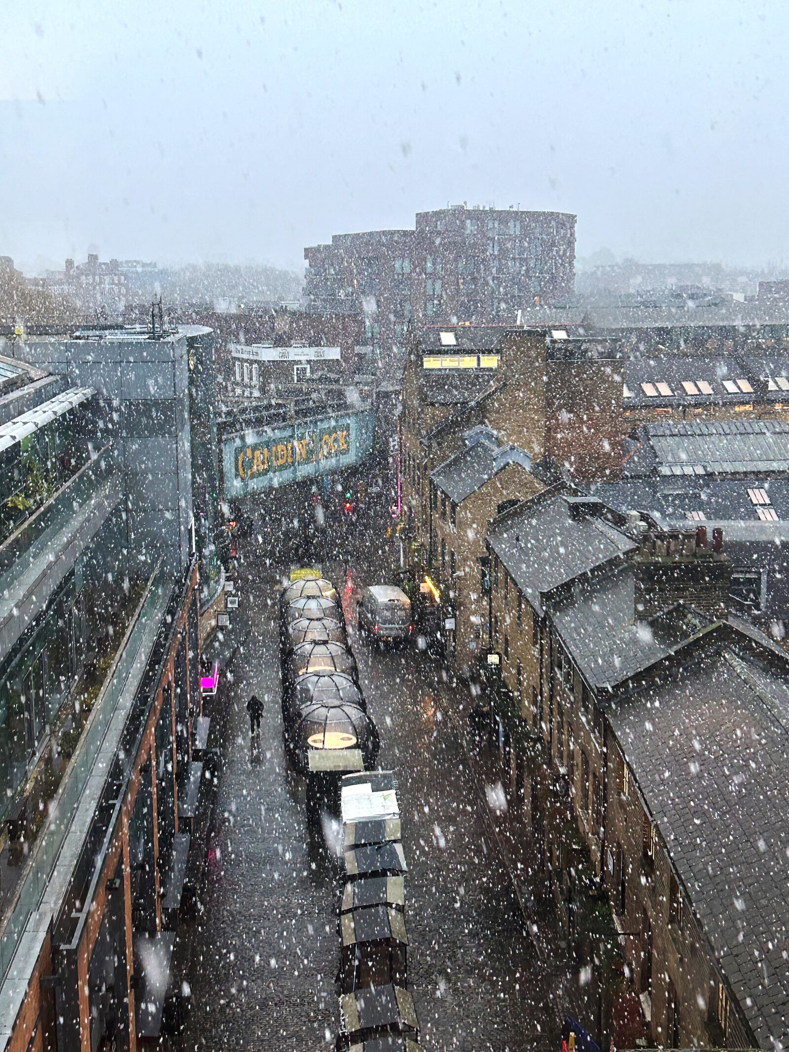 Snow falls in Camden market in London, Nov. 19, 2024. (AP Photo/Jill Lawless)