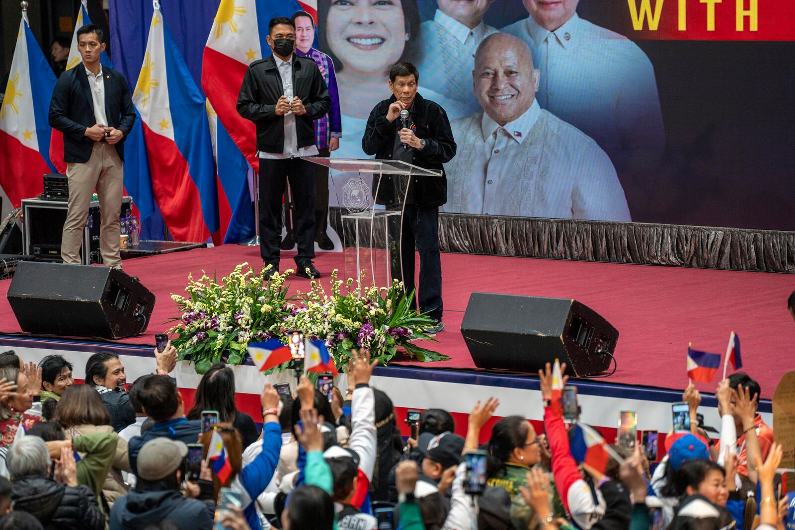 Former President of the Philippines Rodrigo Duterte speaks inside the Southorn Stadium during a thanksgiving gathering organized by Hong Kong-based Filipino workers for the former populist president in Hong Kong on Sunday, March 9, 2025. (AP Photo/Vernon Yuen)