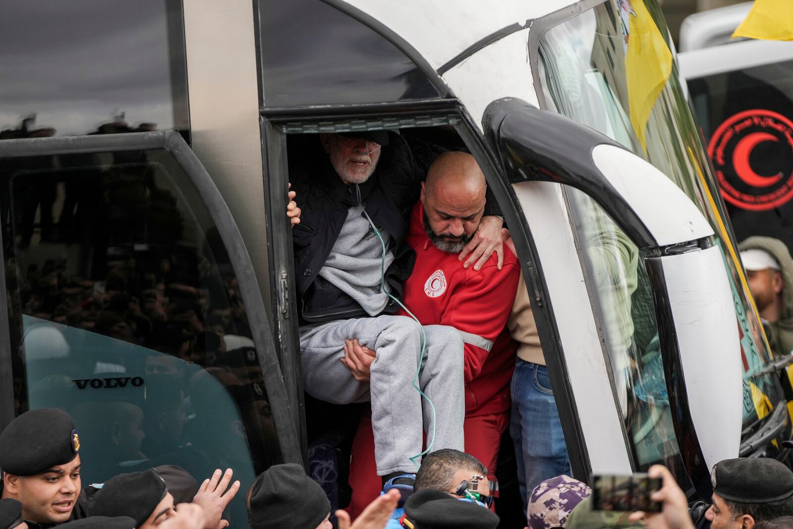 Palestinian prisoners are greeted as they exit a Red Cross bus after being released from Israeli prison following a ceasefire agreement between Israel and Hamas, in the West Bank city of Ramallah, Saturday Feb. 8, 2025. (AP Photo/Mahmoud Illean)