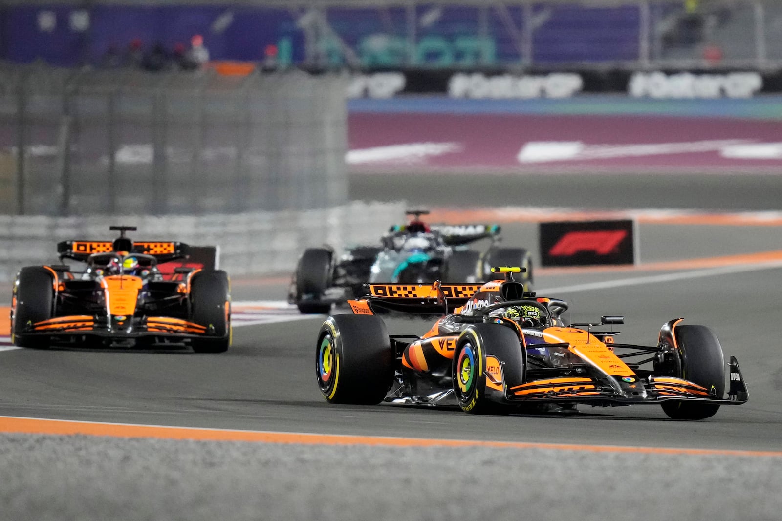 McLaren driver Lando Norris of Britain leads his teammate McLaren driver Oscar Piastri of Australia during sprint race at the Formula One Qatar Grand Prix, at the Lusail International Circuit in Lusail, Qatar, Saturday, Nov. 30, 2024. (AP Photo/ Darko Bandic)