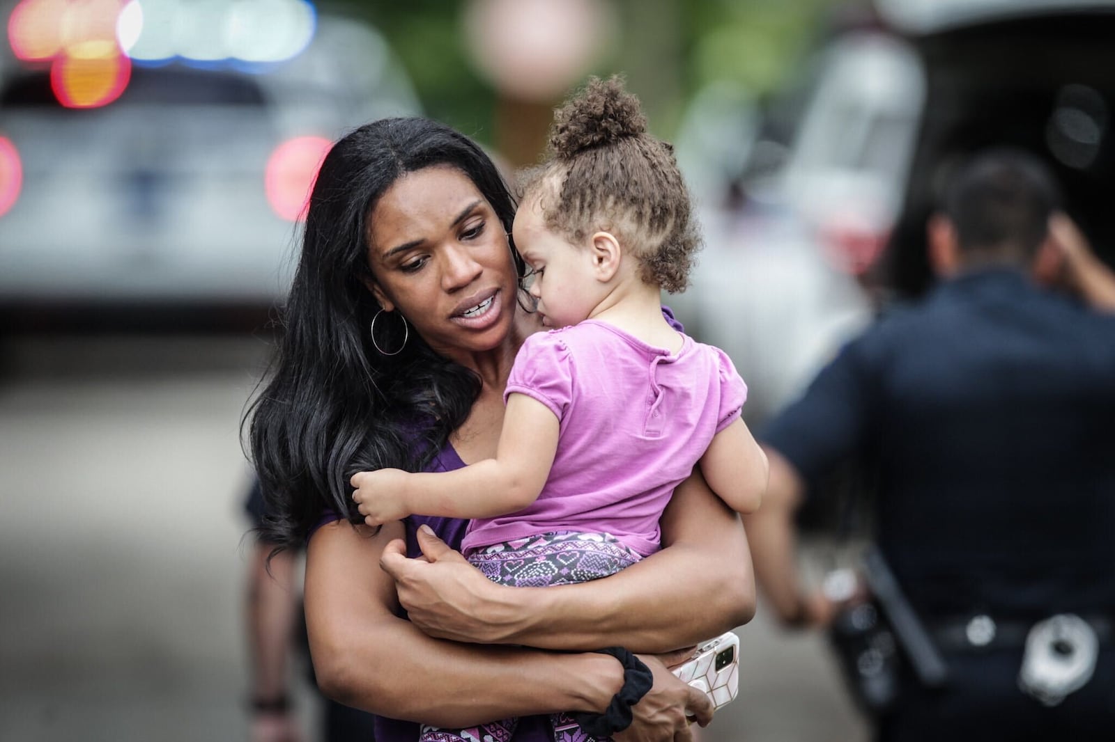 Razshae Wood hugs her daughter, Haleigh, 2, after being reunited when the girl was found Thursday, Aug. 27, 2020. A thief took the car with the girl sleeping in her car seat in the back when her father left it running to go inside a Marathon store. The girl later was found by an Amazon driver. JIM NOELKER/STAFF