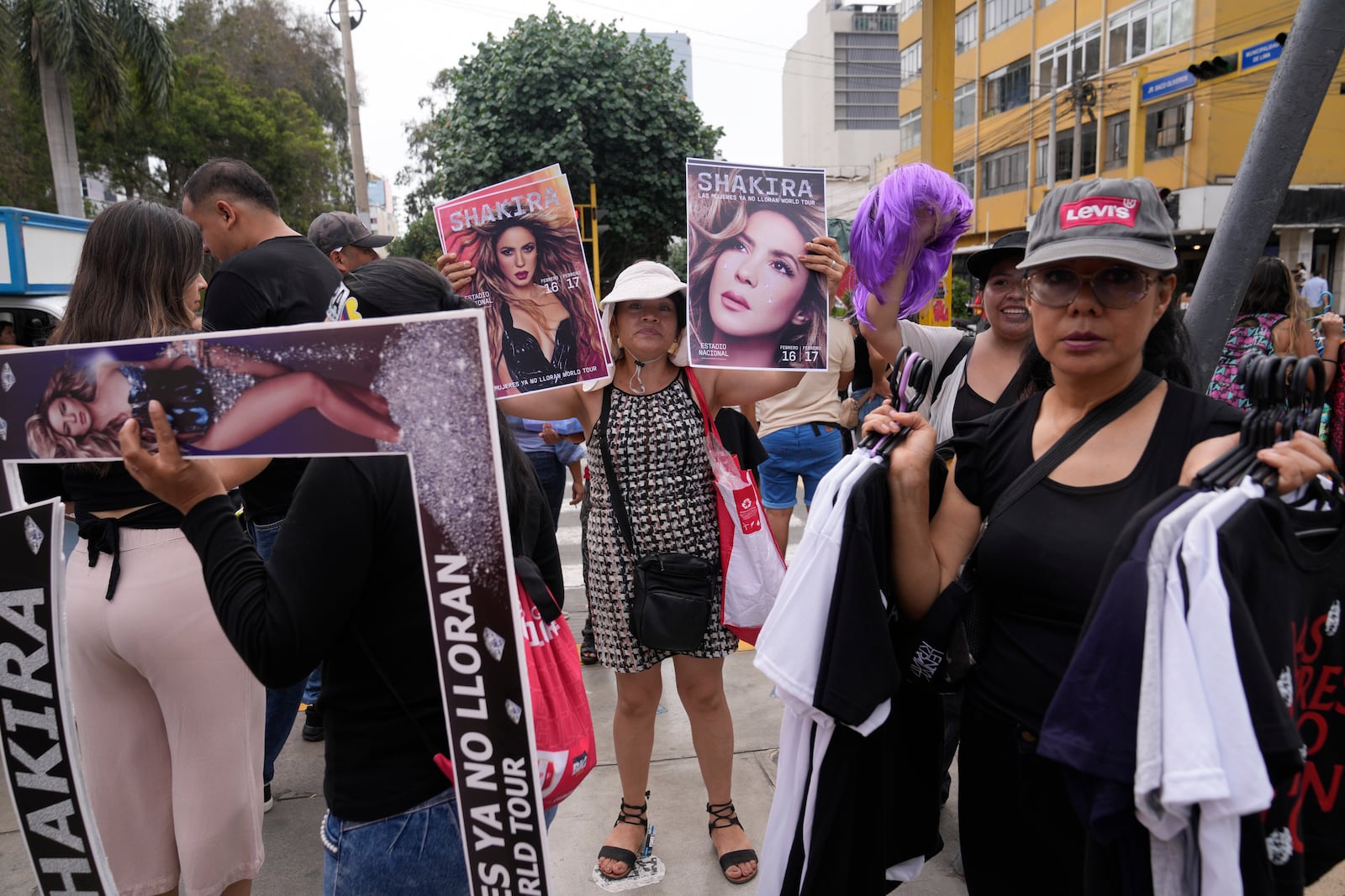 Vendors sell posters of Colombian pop star Shakira outside of the National Stadium after she canceled her concert after being hospitalized, in Lima, Peru, Sunday, Feb. 16, 2025. (AP Photo/Martin Mejia)