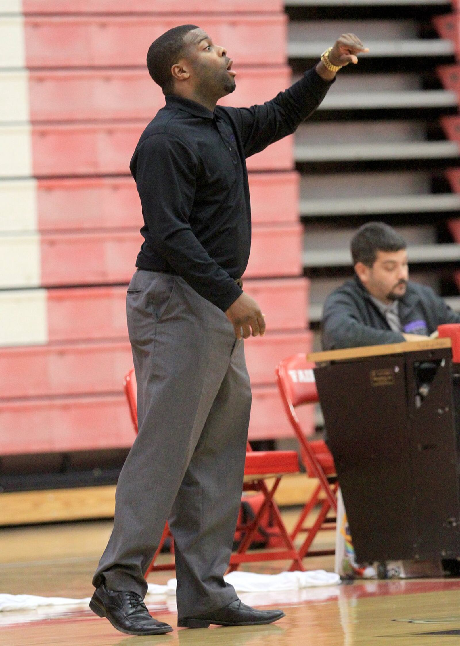 Middletown girls basketball coach Kelven Moss guides his team during a game at Fairfield on Dec. 10, 2014. CONTRIBUTED PHOTO BY E.L. HUBBARD