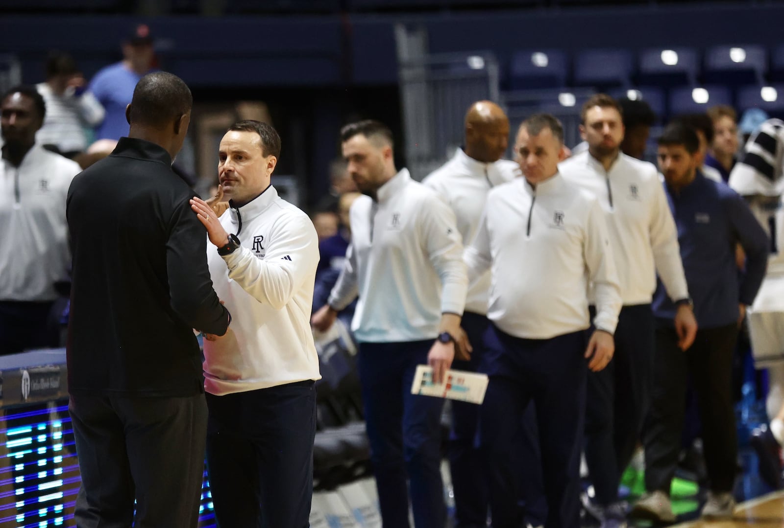 Dayton's Anthony Grant, left, greets Rhode Island's Archie Miller after the game on Wednesday, Feb. 26, 2025, at the Ryan Center in Kingston, R.I. David Jablonski/Staff