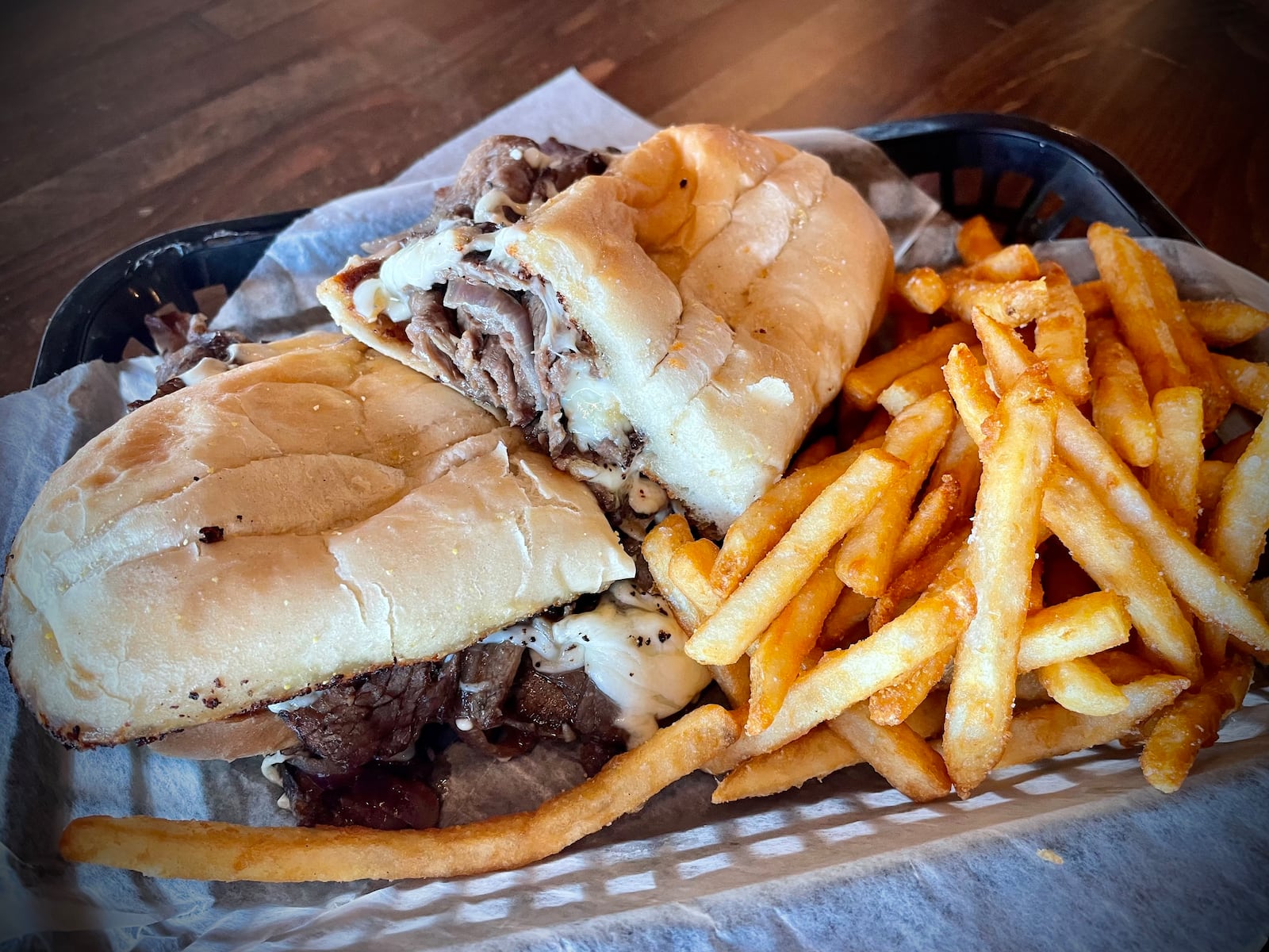 Crooked Handle Brewing Co. has two locations in the region: 123 N. Main St. in Piqua and 760 N. Main St. in Springboro. Pictured is the Smoked Brisket Sandwich. NATALIE JONES/STAFF