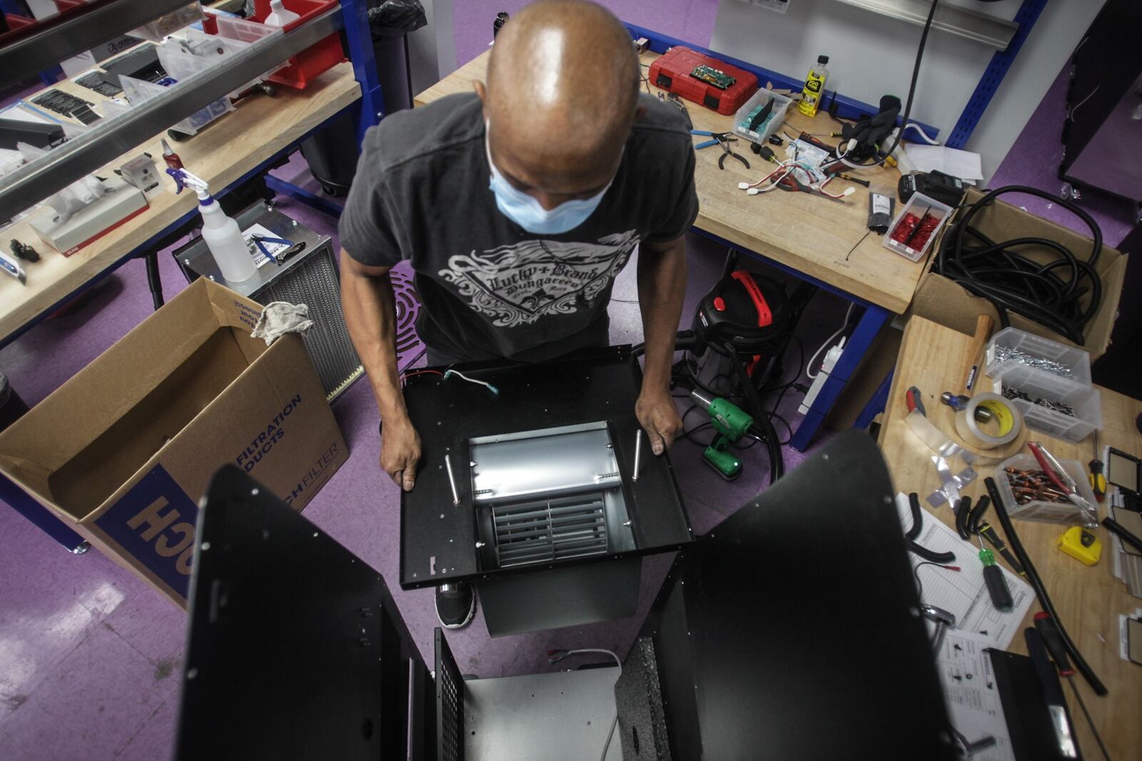 Aerobiotix assembly technician, Joe Gore puts together a device that clean the air. The Miamisburg company rode the pandemic to 1,000% sales growth in 2020.