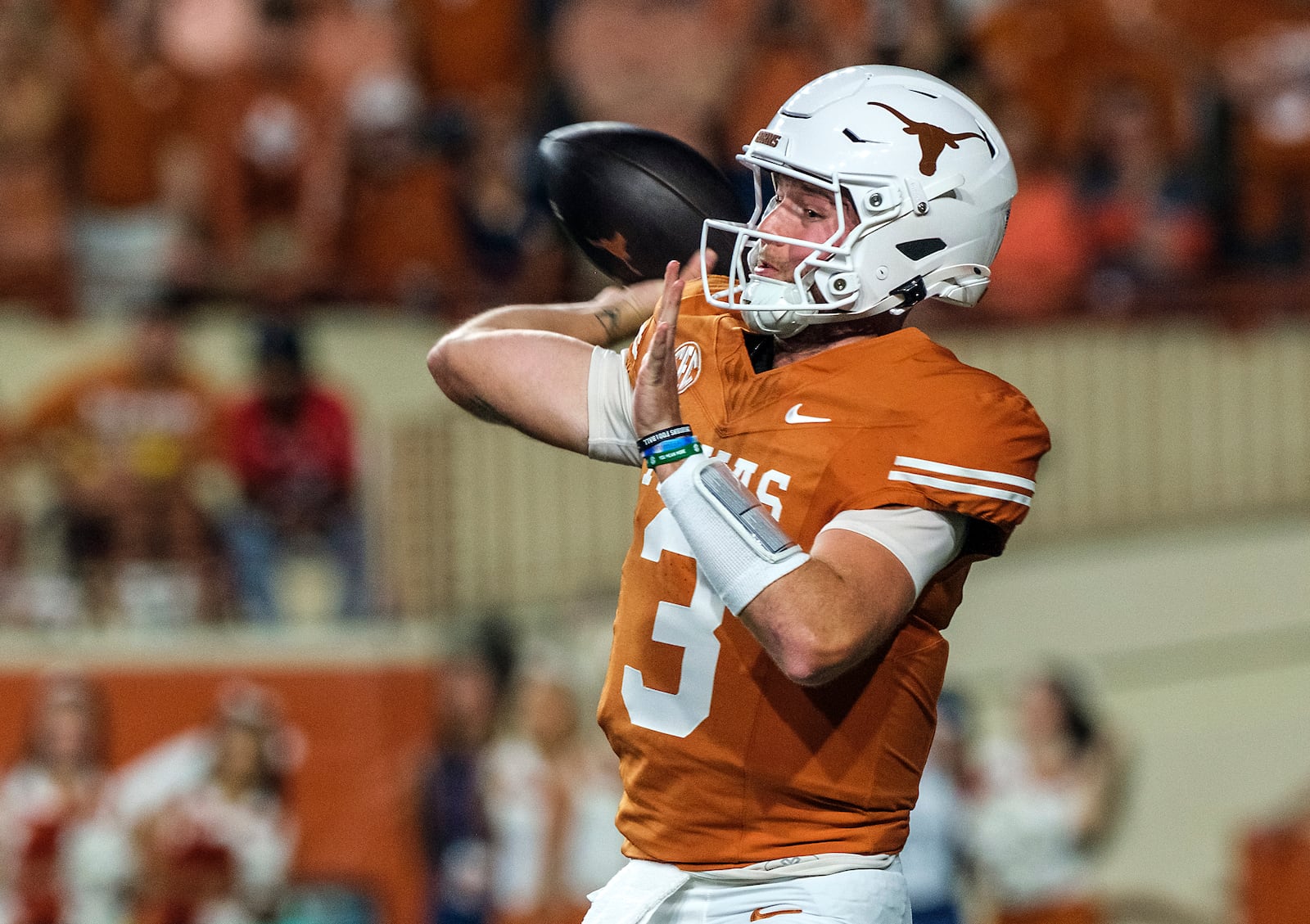 Texas quarterback Quinn Ewers (3) throws down field against Georgia during the first half of an NCAA college football game in Austin, Texas, Saturday, Oct. 19, 2024. (AP Photo/Rodolfo Gonzalez)