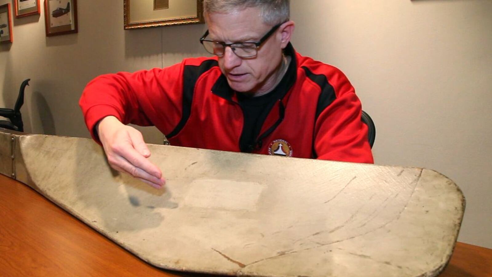 Ron Kaplan announced his resignation in 2017 as enshrinement and outreach director of the National Aviation Hall of Fame. In this February 2017 photo, Kaplan points out the signature of Orville Wright on an original Wright propeller. FILE