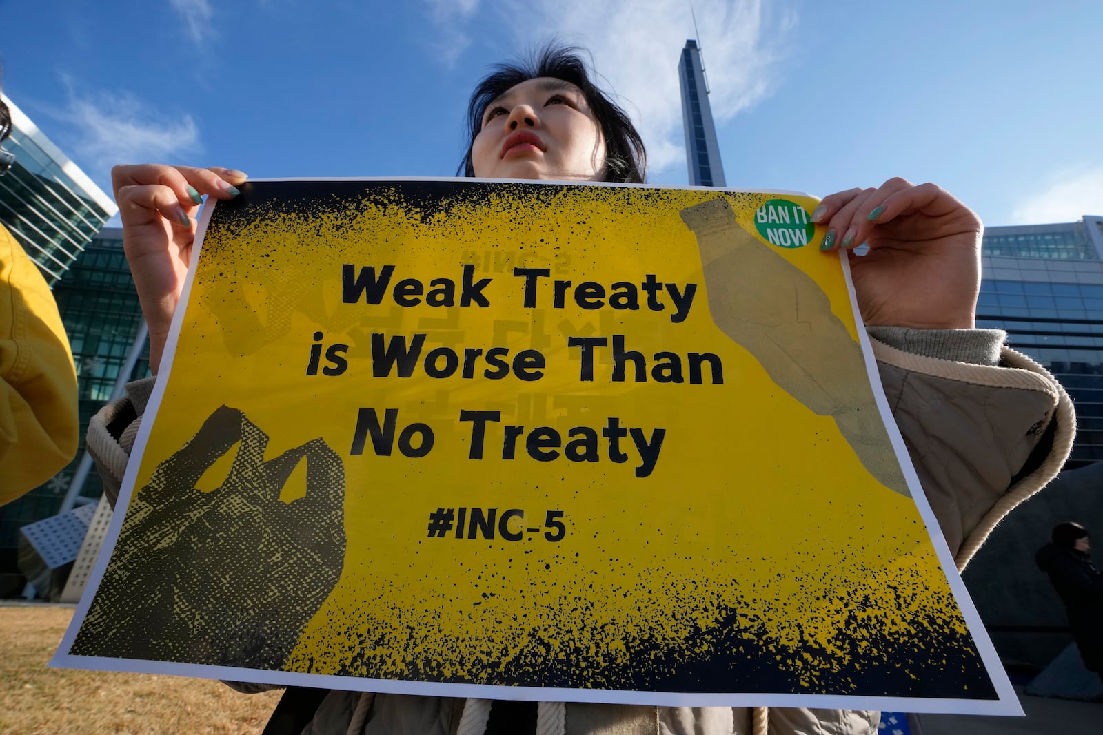 A South Korean environment activist protests calling for a strong global plastics treaty outside of the venue for the fifth session of the Intergovernmental Negotiating Committee on Plastic Pollution in Busan, South Korea, Sunday, Dec. 1, 2024. (AP Photo/Ahn Young-joon)