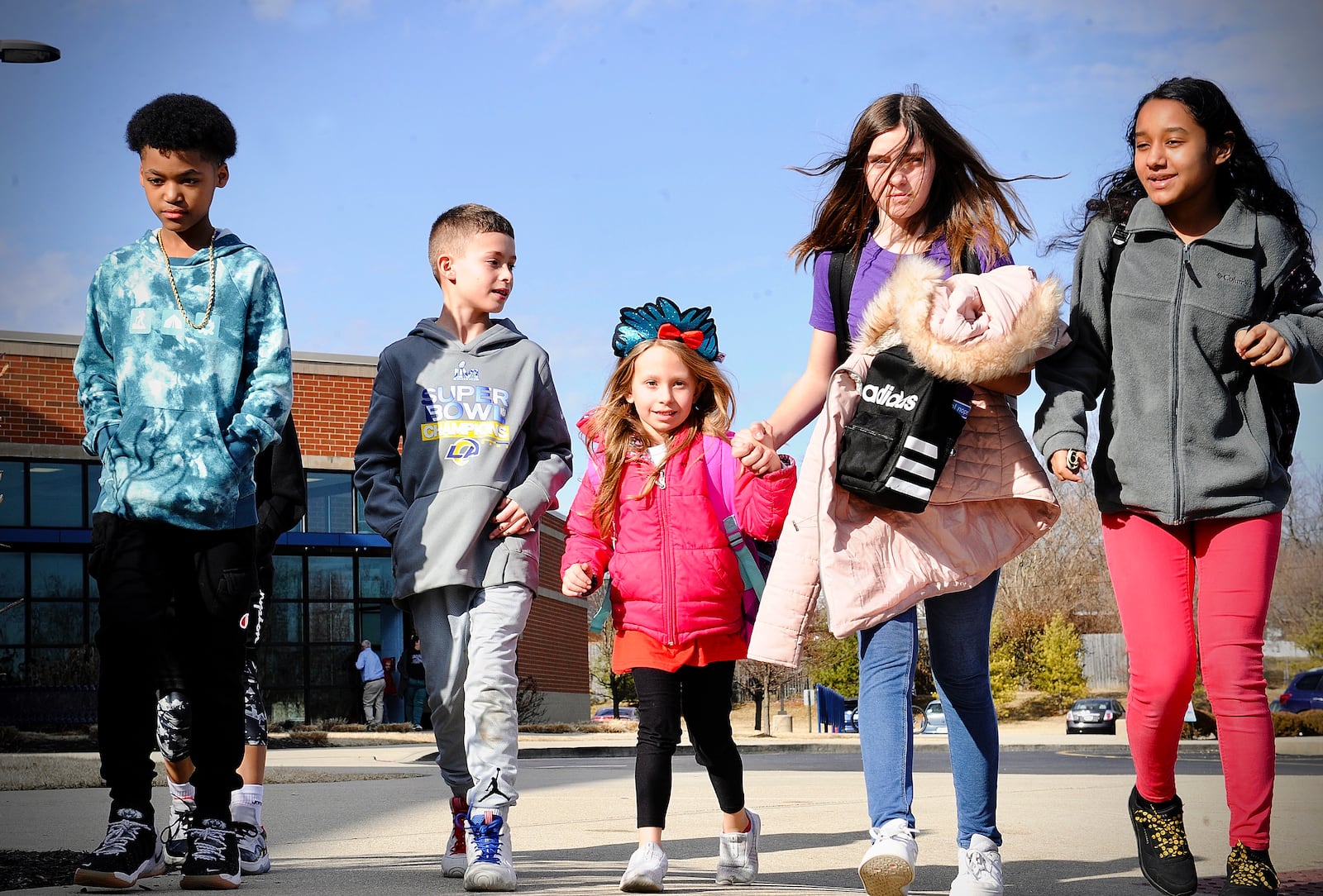 Huber Heights students get on the bus at Valley Forge Elementary School on Thursday. Huber Heights is one of the local districts that saw an increase in its chronic absenteeism rate last school year compared to pre-pandemic levels. Marshall Gorby / Staff