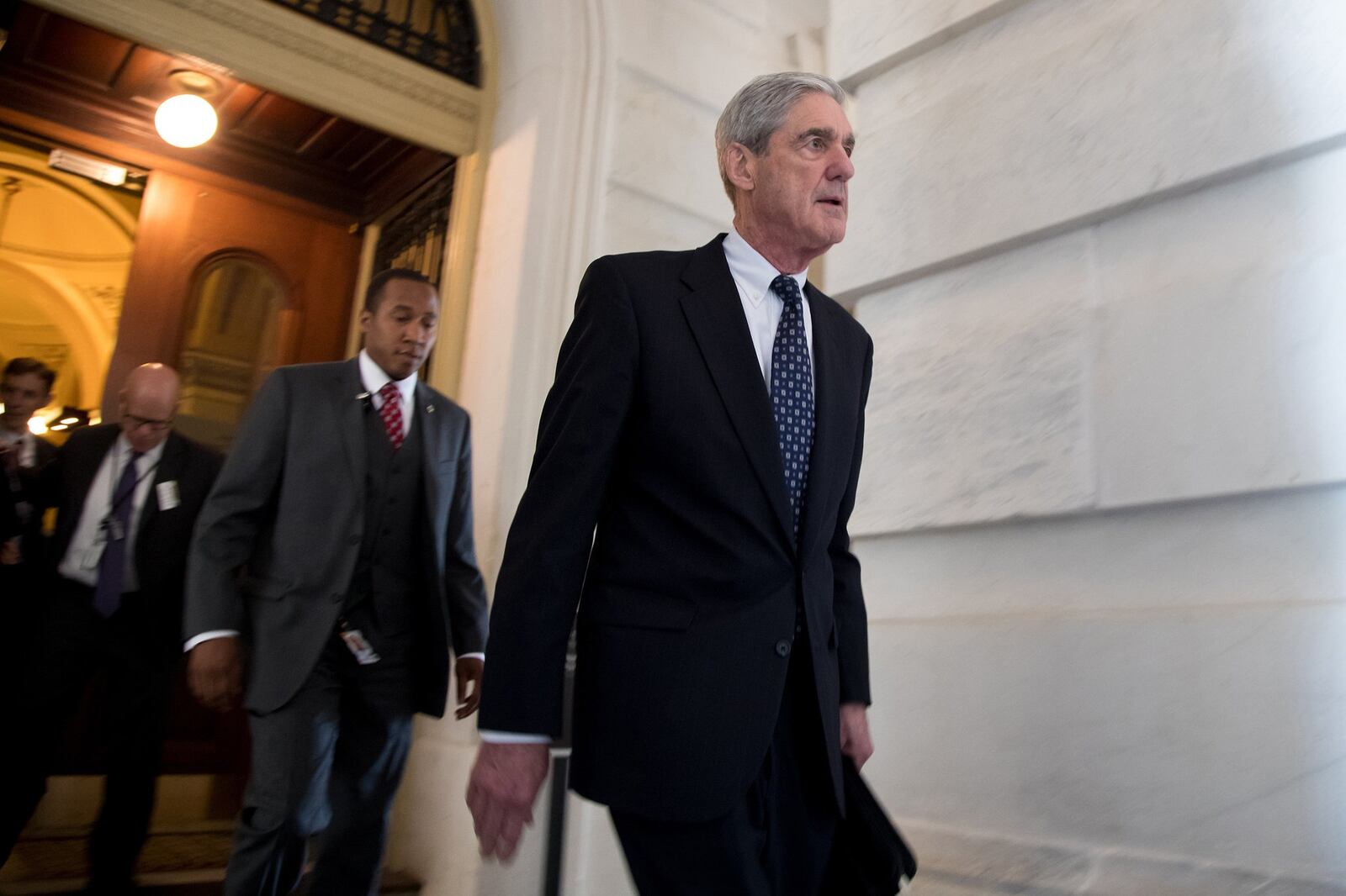 Special Counsel Robert Mueller, front, is probing Russian interference in the 2016 U.S. election. His investigation is seen as a wild card as Democrats and Republicans battle for control of Congress. (Ting Shen/Xinhua/Zuma Press/TNS)