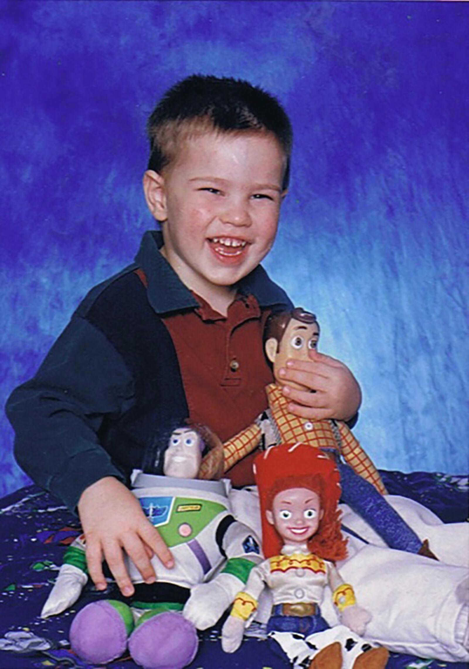 Hunter Garrett of Huber Heights was diagnosed with autism when he was 4 years old. He is shown at age 2 with his favorite toys from the Pixar Animation Studios film "Toy Story," which inspired him to pursue a career in graphic design. CONTRIBUTED