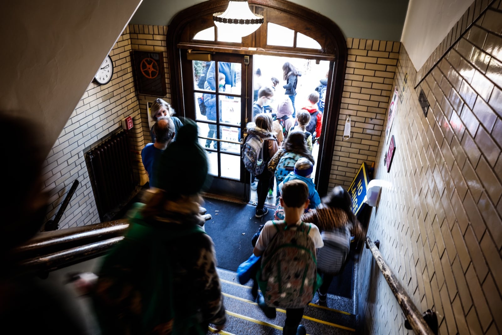 Students at Smith Elementary School exit the building Monday, Jan. 3, 2022, after returning to school from the holidays. Because of a rise in COVID-19 cases, all Oakwood students must wear a mask through the end of January. Jim Noelker/Staff 