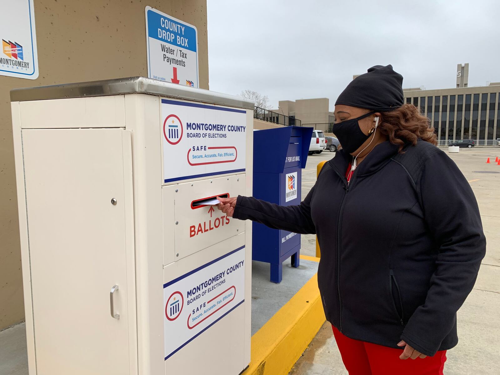 Yolanda Clark of Jefferson Twp. casts her ballot using a drop box at the Montgomery County Board of Elections Wednesday, Oct. 28.