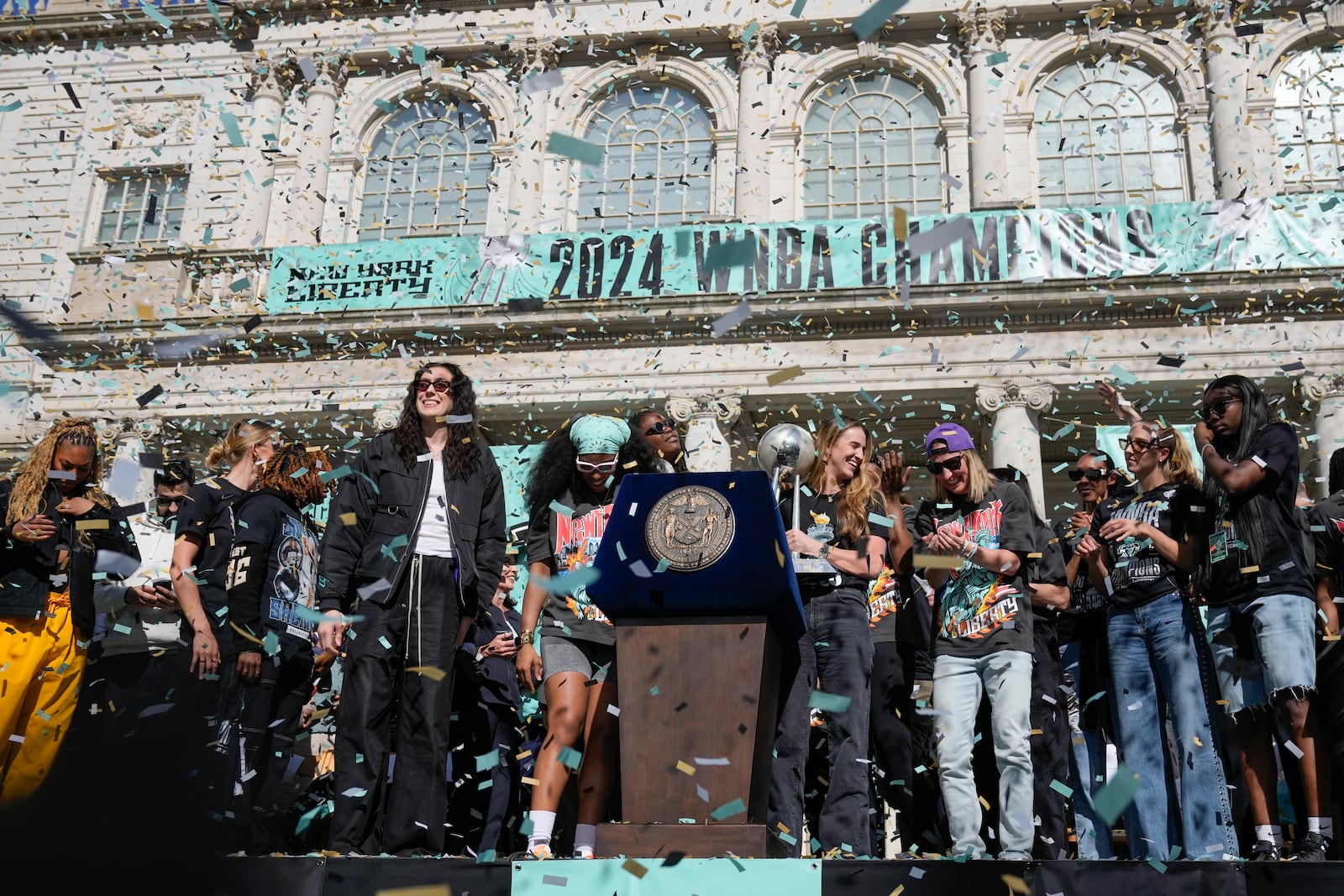 The New York Liberty, their supporters, local officials and others celebrate during a ceremony after a parade in honor of the Liberty's WNBA basketball championship at City Hall in New York, Thursday, Oct. 24, 2024. (AP Photo/Seth Wenig)