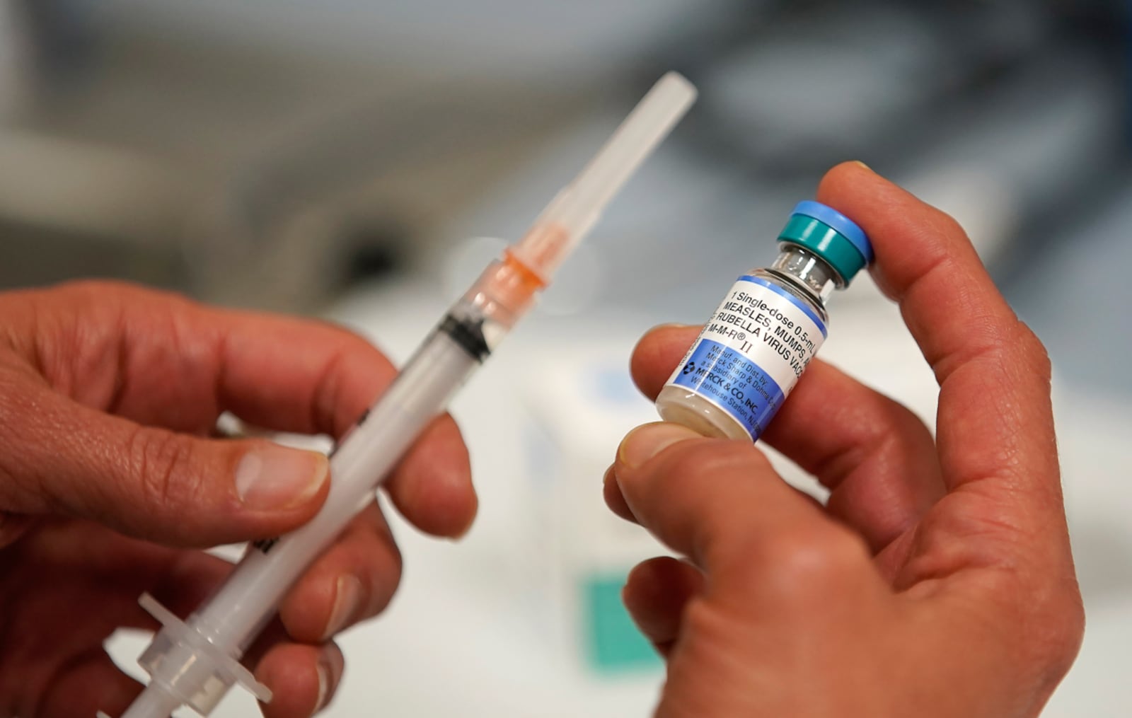 In this photo illustration a one dose bottle of measles, mumps and rubella virus vaccine, made by MERCK, is held up at the Salt Lake County Health Department on April 26, 2019 in Salt Lake City, Utah. A ship has been quarantined after a crew member came down with measles.