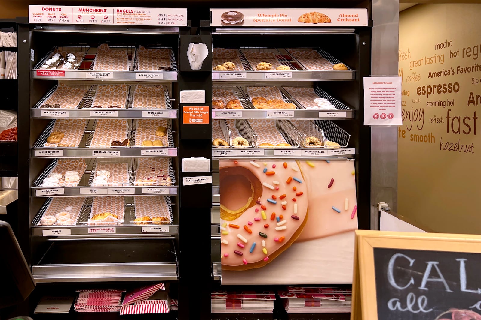 Inside a Dunkin' Donuts restaurant shows a very limited selection of doughnuts for sale, Friday, Jan. 10, 2025, in Tempe, Ariz. (AP Photo/Ross D. Franklin)