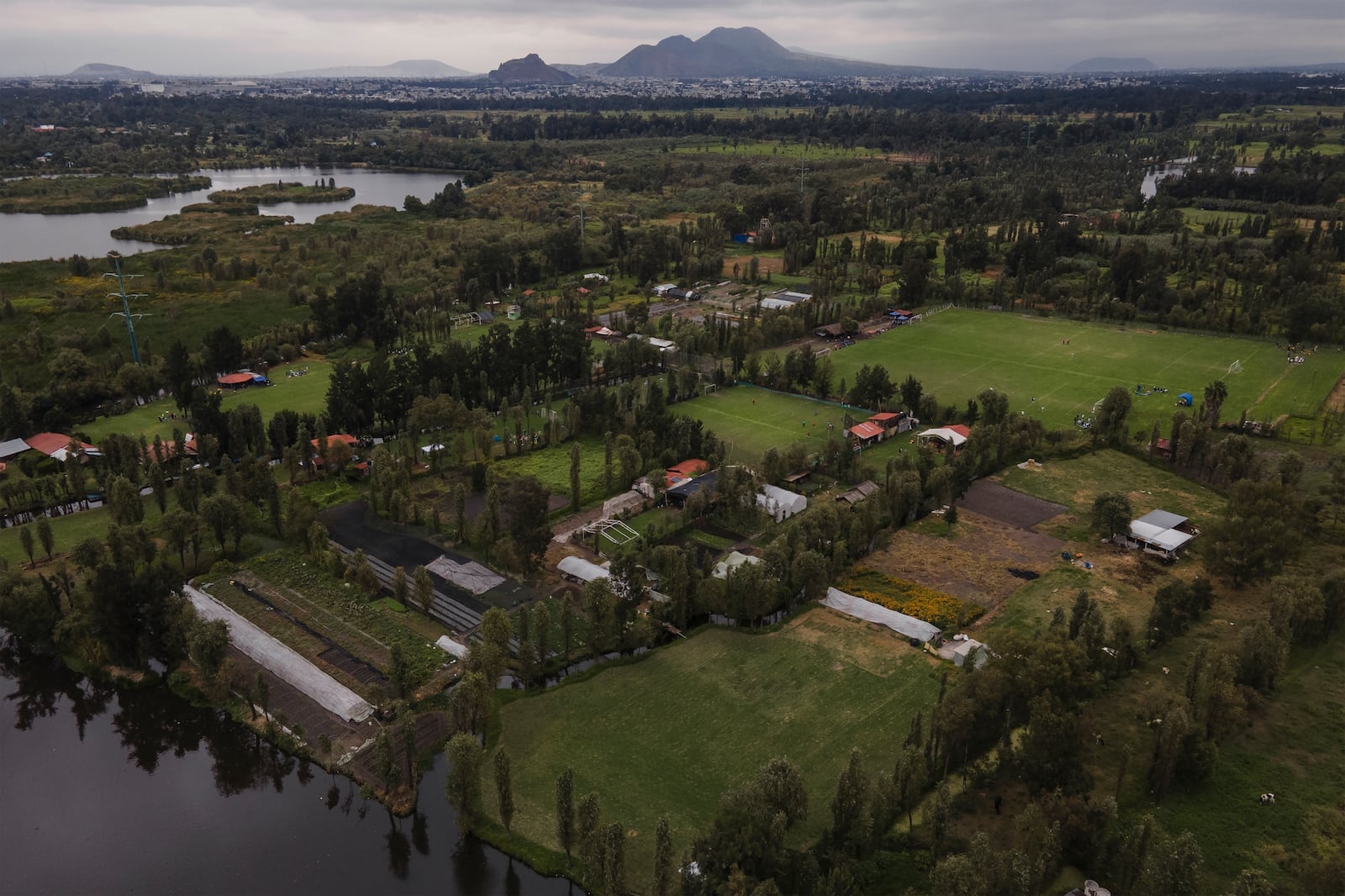 FILE - Ancestral floating gardens are visible next to new soccer fields on Xochimilco Lake in Mexico City, Oct. 20, 2024. (AP Photo/Felix Marquez, File)