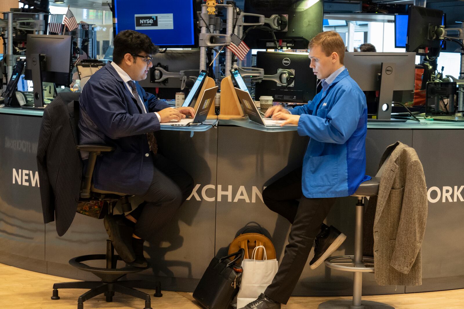 FILE - People work on the New York Stock Exchange trading floor in New York on November 21, 2024. (AP Photo/Ted Shaffrey, File)