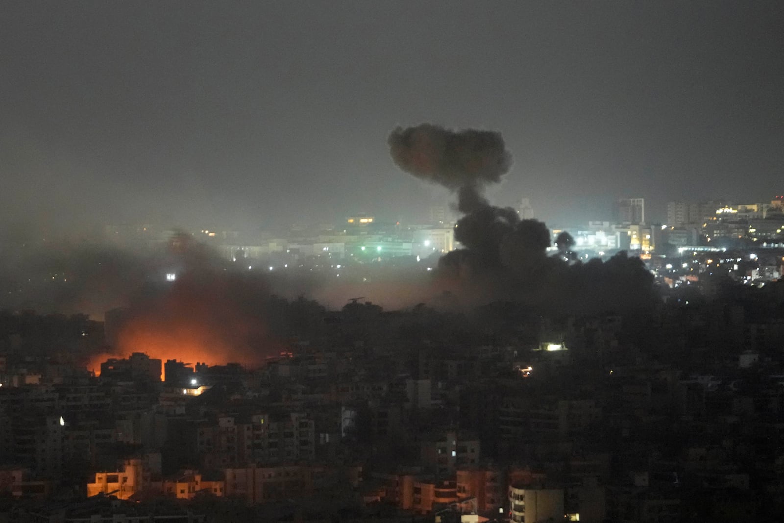 Flame and smoke rise from Israeli airstrikes on Dahiyeh, in the southern suburb of Beirut, Lebanon, early Friday, Nov. 1, 2024. (AP Photo/Hussein Malla)