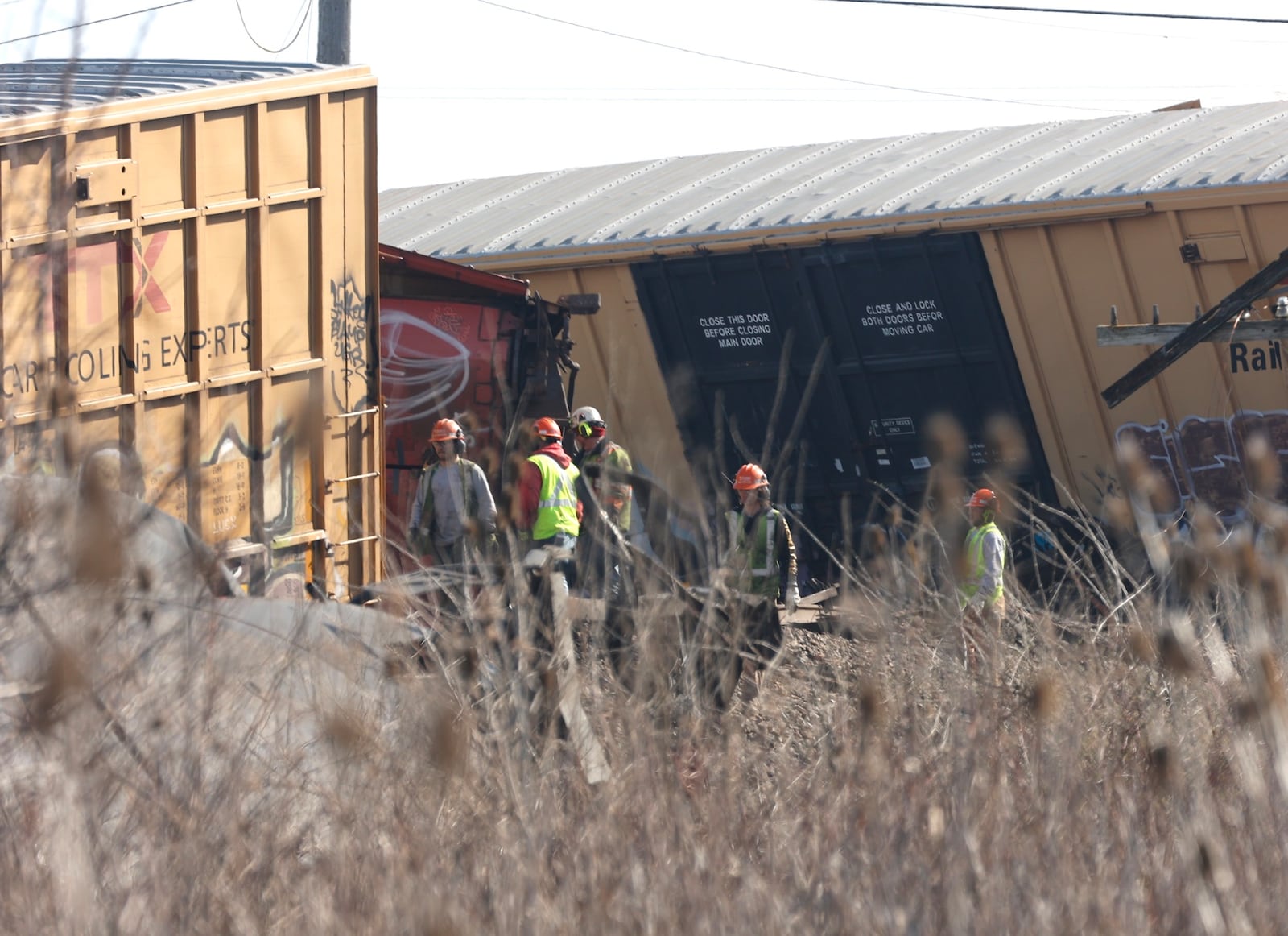 Railroad personnel work to clean up the derailment Sunday,  March 5, 2023 in Clark County at the Ohio Route 41 crossing. BILL LACKEY/STAFF