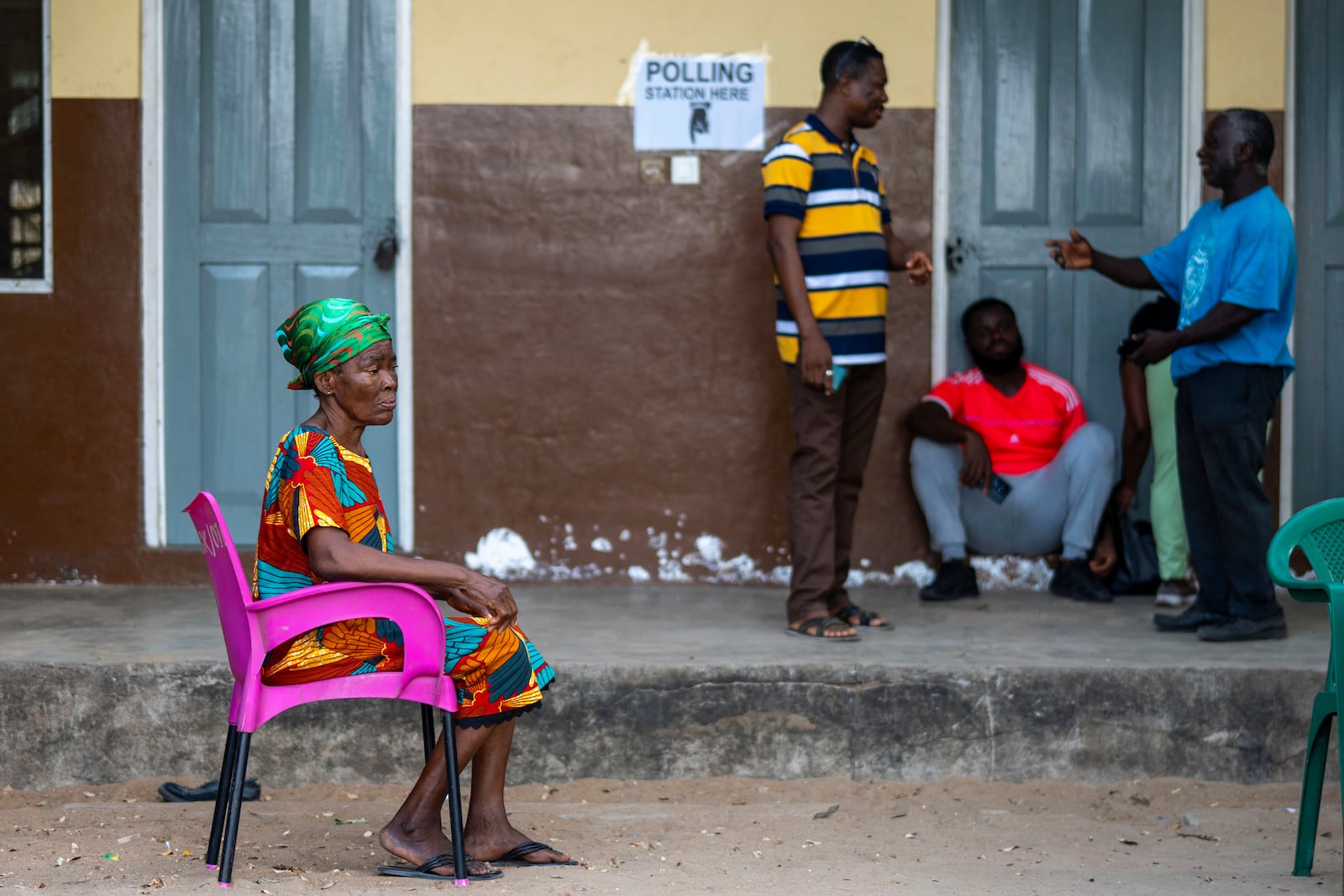 Electoral commission volunteers wait for the opening of the polling stations for the general elections in Accra, Ghana, Saturday, December 7, 2024 (AP Photo/Jerome Delay)